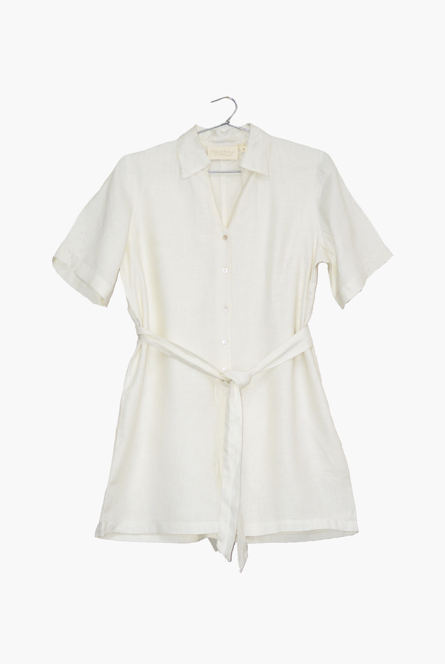 White dress on a hanger against a white background