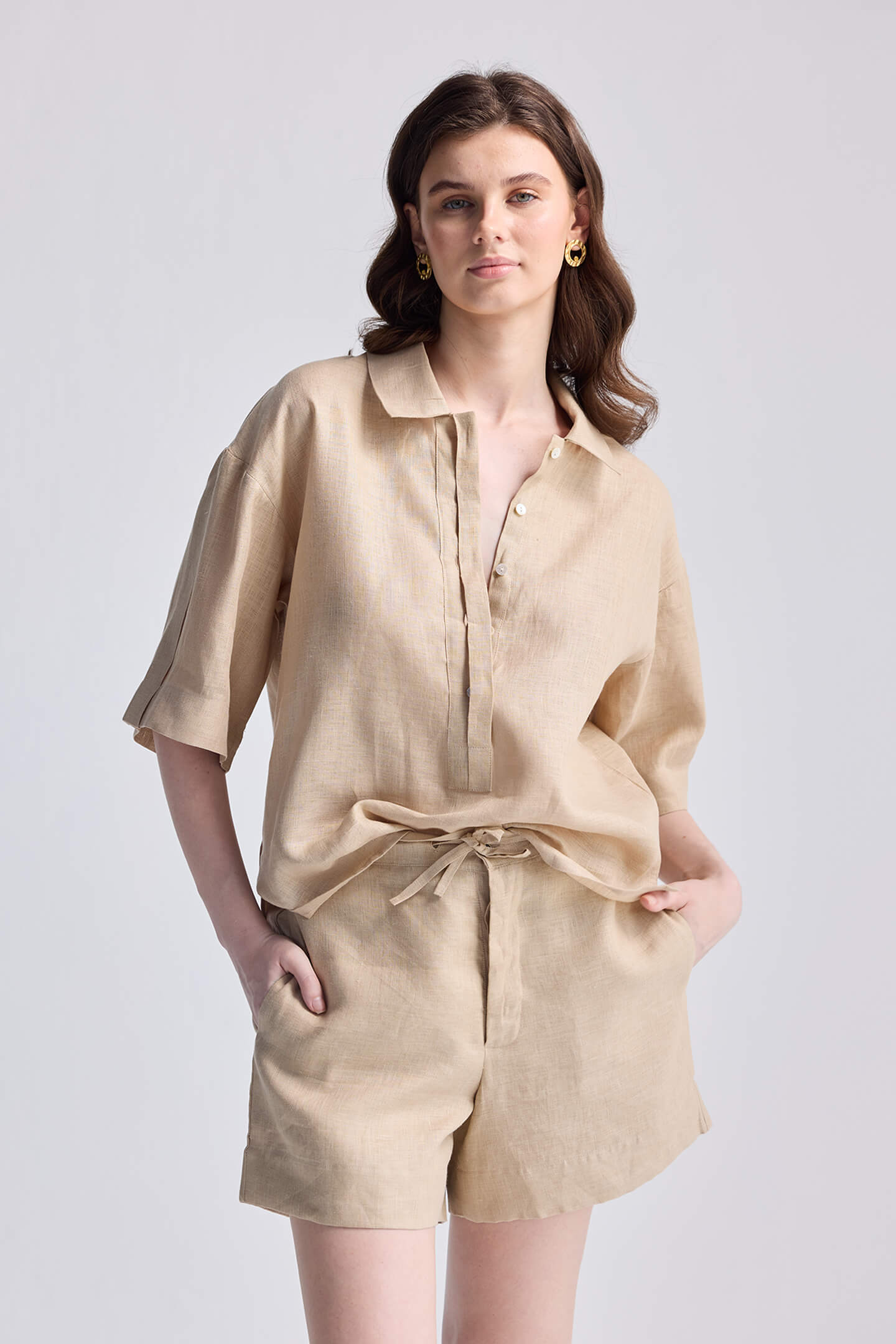 Studio product shot of the reistor Drawstring Shorts in Neutral Beige emphasizing the comfortable elastic waistband and minimalist design.