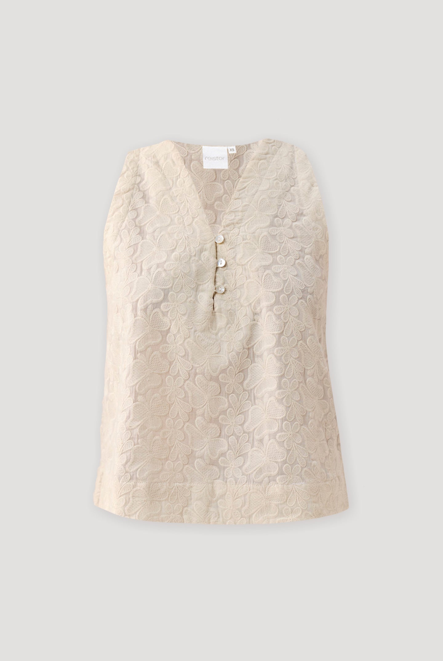 Embroidered Button Front Neck Top in Cream featuring intricate tonal floral embroidery, a sleeveless silhouette, and a V-neckline with pearl-style button-front detailing, displayed on a light background to highlight the textured fabric and elegant design.