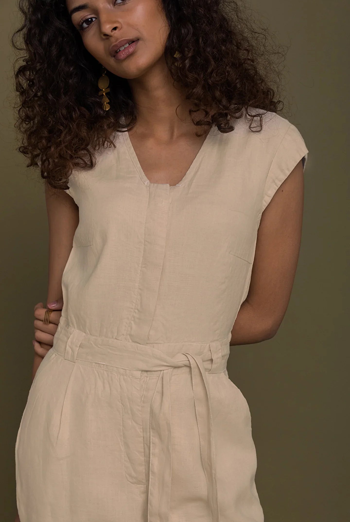 Reistor Evening Chai Jumpsuit in Neutral Beige for women with a flattering V-neck, tie waist and relaxed fit