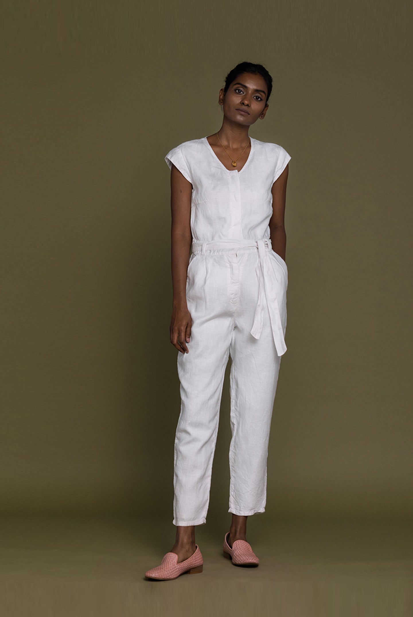 Reistor Evening Chai Jumpsuit in White featuring a relaxed silhouette, tie waist, breathable fabric, and timeless elegance