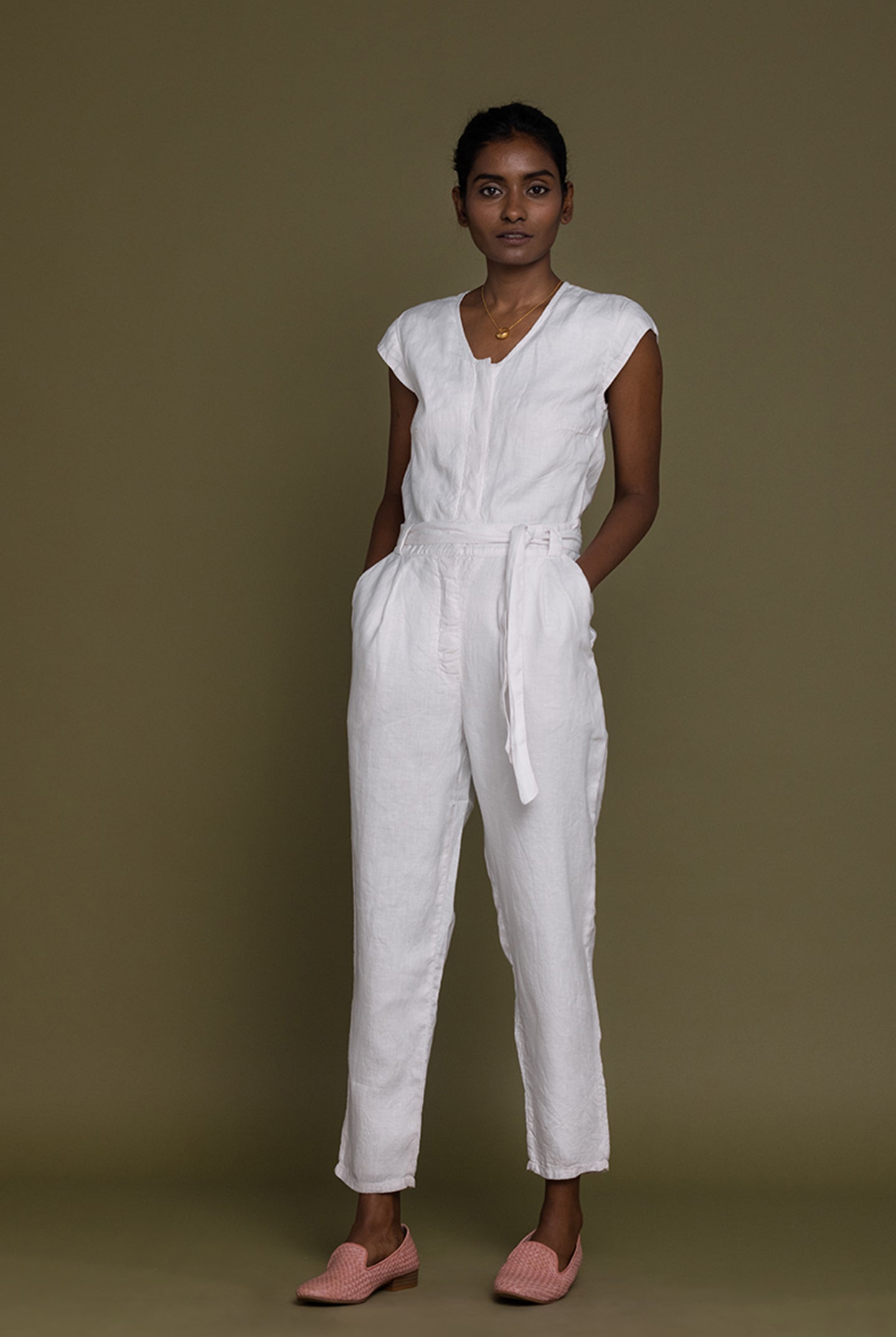 Reistor Evening Chai Jumpsuit in White with a minimalist V-neck, relaxed fit, breathable linen for effortless style