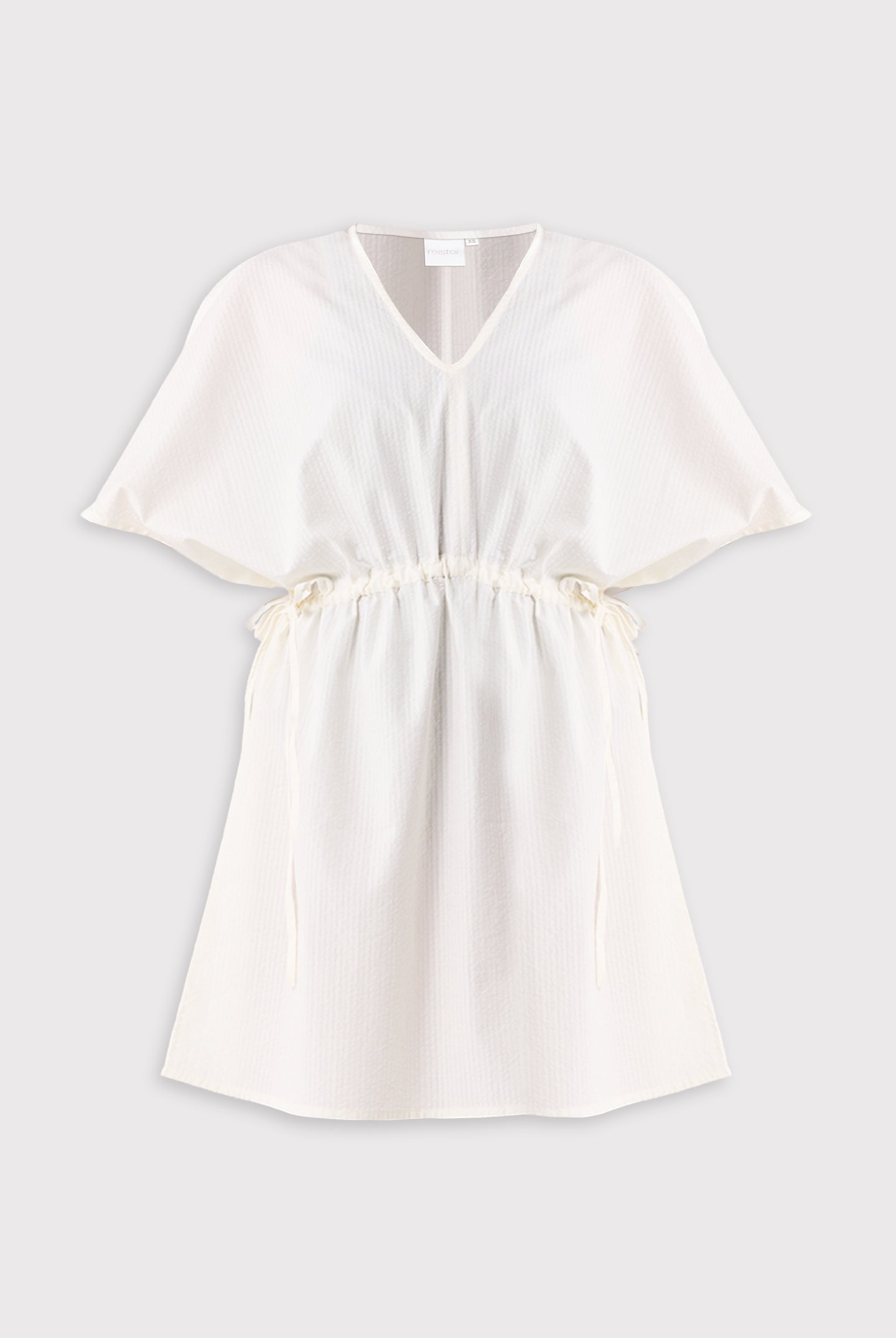 White dress on a light gray background