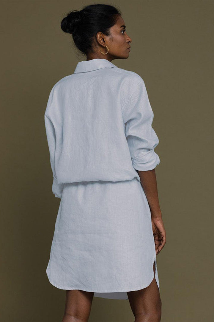 Meet Me by the Cliff Dress in Blue by Reistor, back view of a sustainable blue shirt dress for women with long sleeves