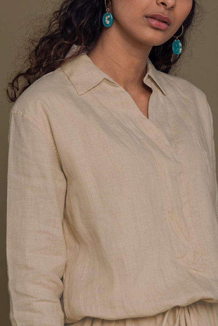 Meet me by the Cliff Dress in Neutral Beige by Reistor features a timeless collared design, breathable comfort, relaxed fit, and sustainable style.