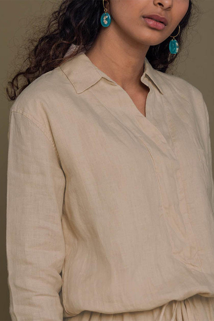 Meet me by the Cliff Dress in Neutral Beige by Reistor features a timeless collared design, breathable comfort, relaxed fit, and sustainable style.