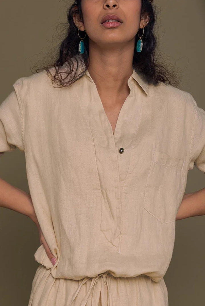 Meet me by the Cliff Dress in Neutral Beige by Reistor, front detail of a sustainable beige shirt dress for women