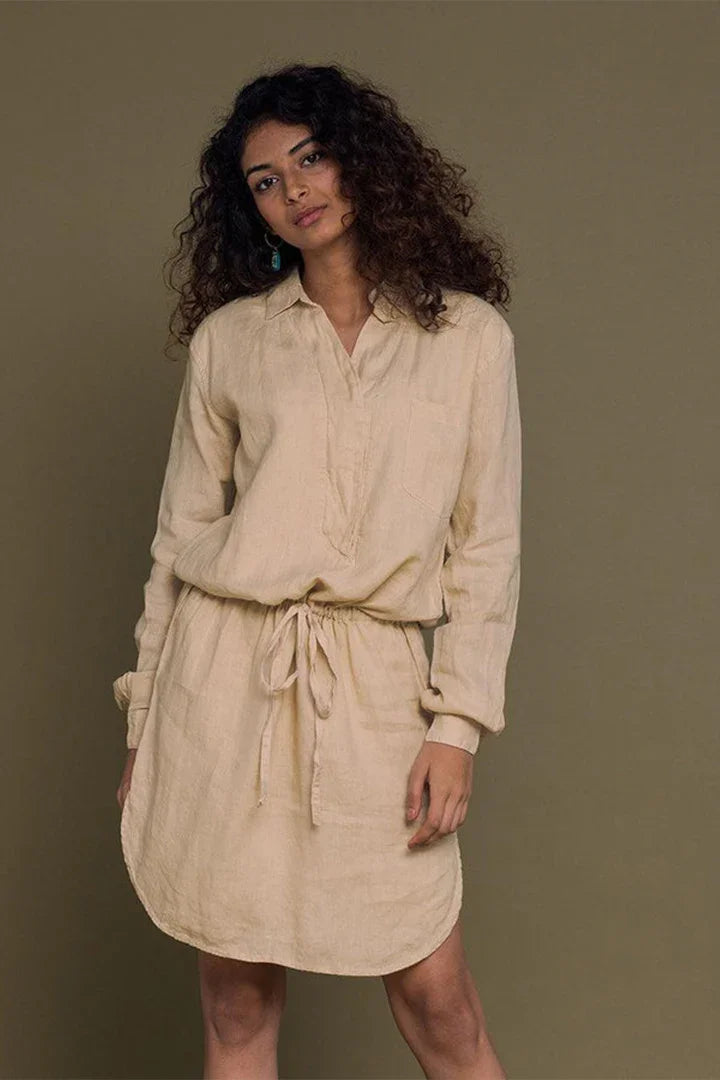 Discover the Meet me by the Cliff Dress in Neutral Beige by Reistor, a sustainable women's dress with a relaxed silhouette, breathable comfort, and timeless style.