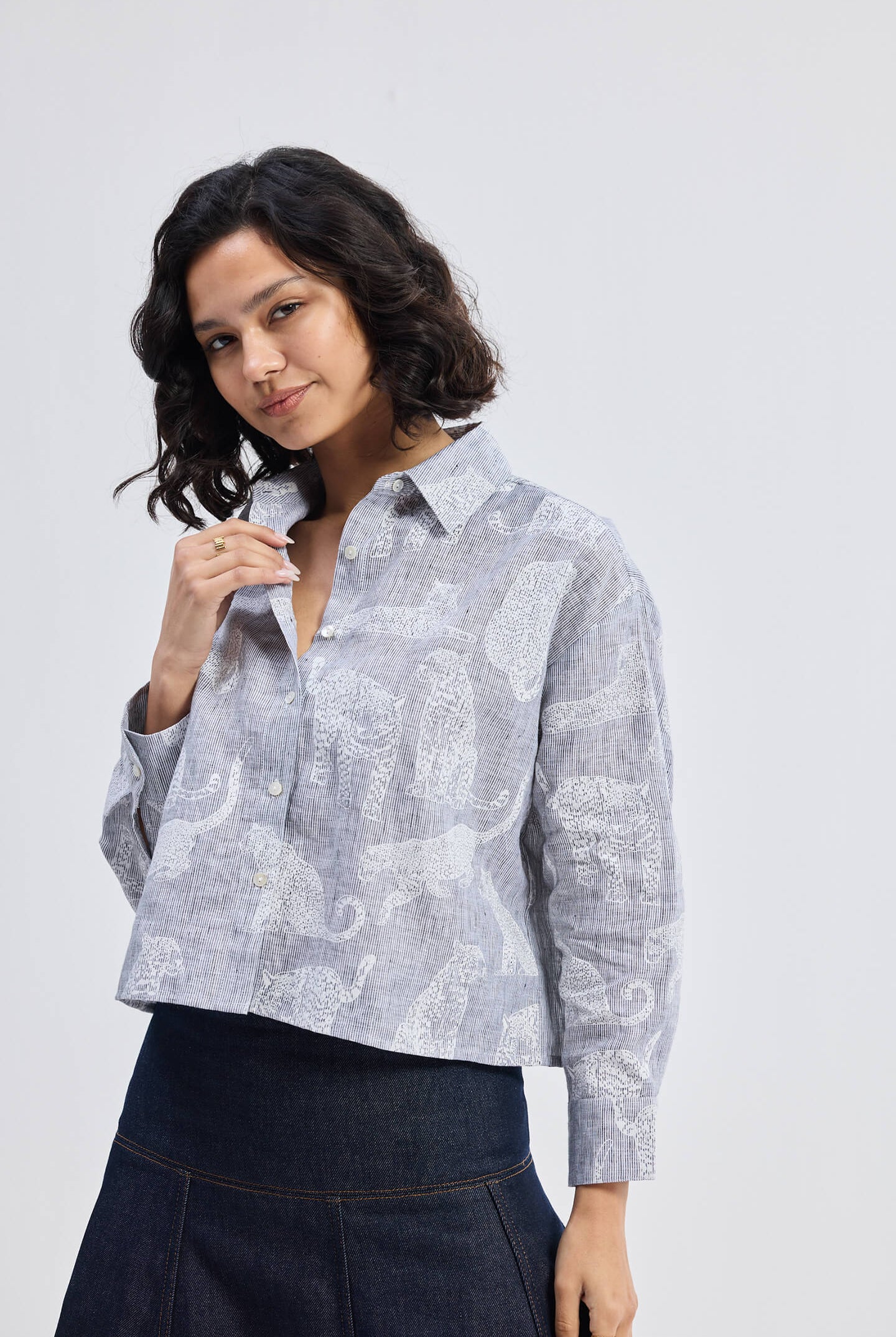 reistor Oversized Boxy-fit Shirt in Animal Print, front close-up view worn by model with denim skirt