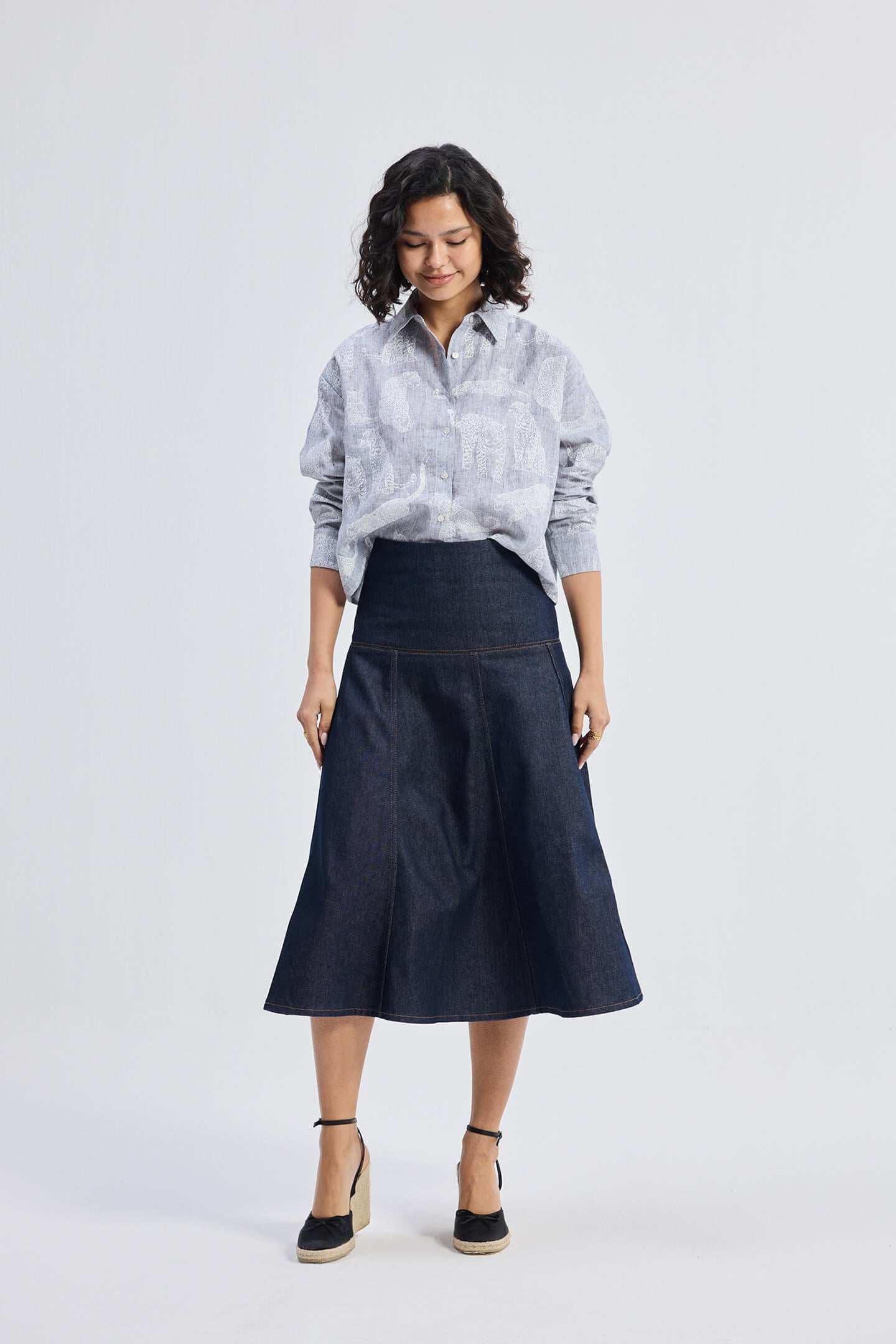 reistor Oversized Boxy-fit Shirt in Animal Print, full front view styled with denim midi skirt and wedge sandals