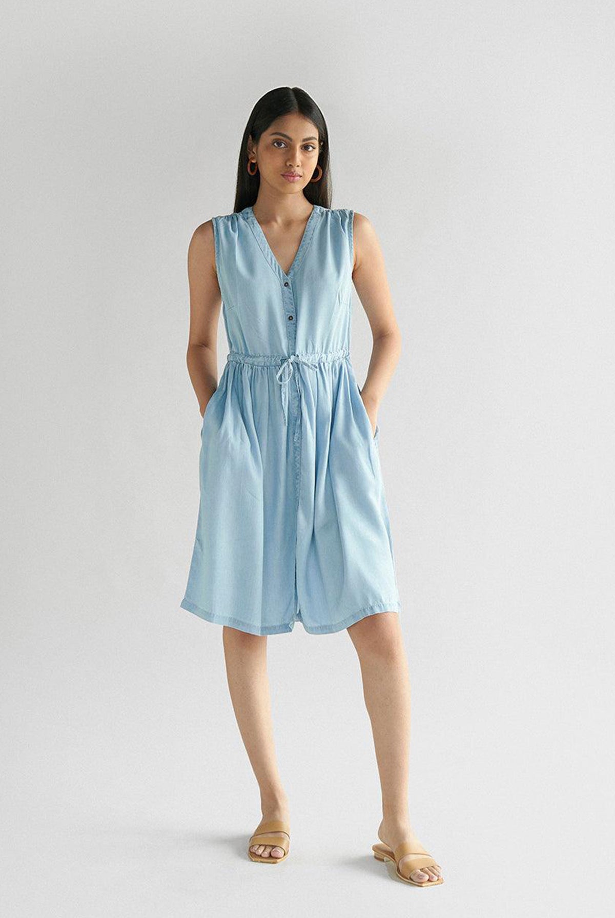 Reistor Pina Colada Dress in Ocean Blue, sleeveless V-neck dress with a button-front, adjustable drawstring waist and pockets, perfect for effortless summer style.