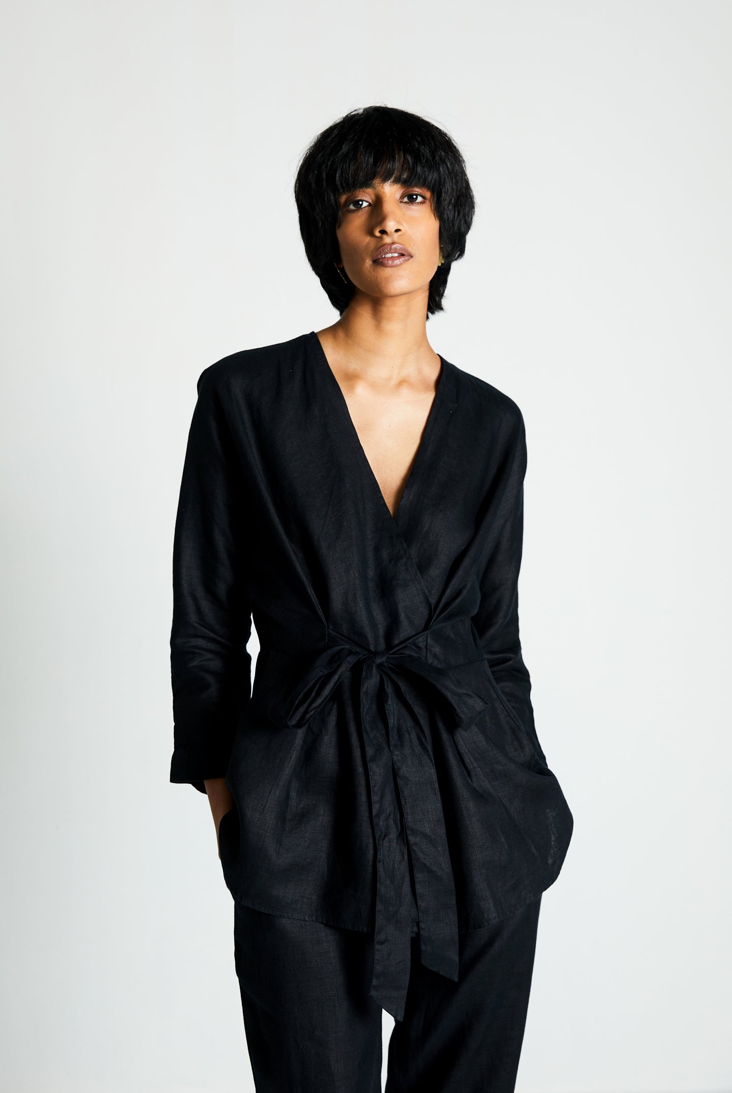 Reistor Power Moves Shirt in Black, black hemp shirt with a tie-up waist, relaxed fit, breathable sustainable women's top for effortless everyday style.