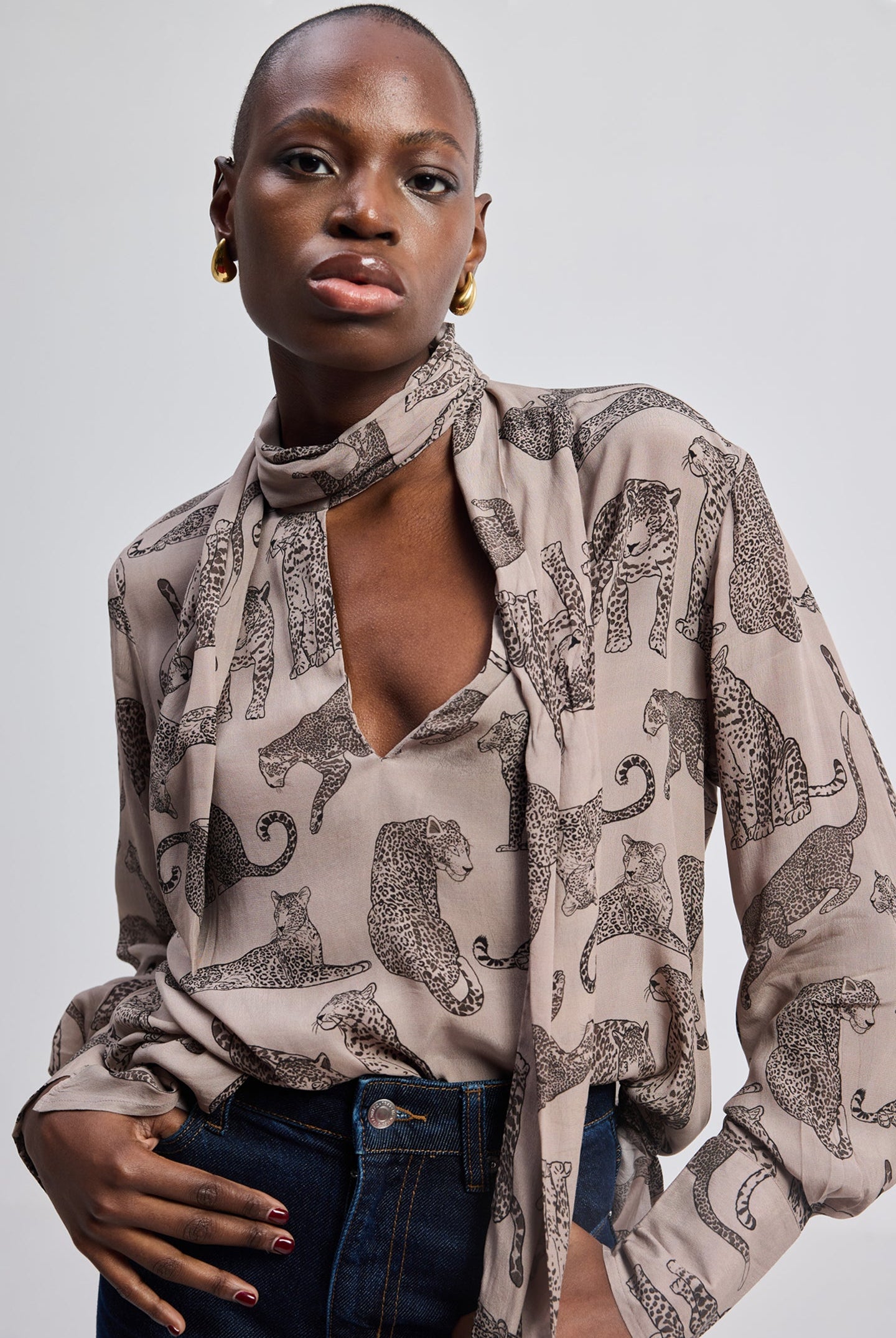 Reistor Relaxed-Fit Top with Front-tie in Animal Print, featuring a lightweight printed fabric, front tie-neck detail, long sleeves, and a modern relaxed silhouette.