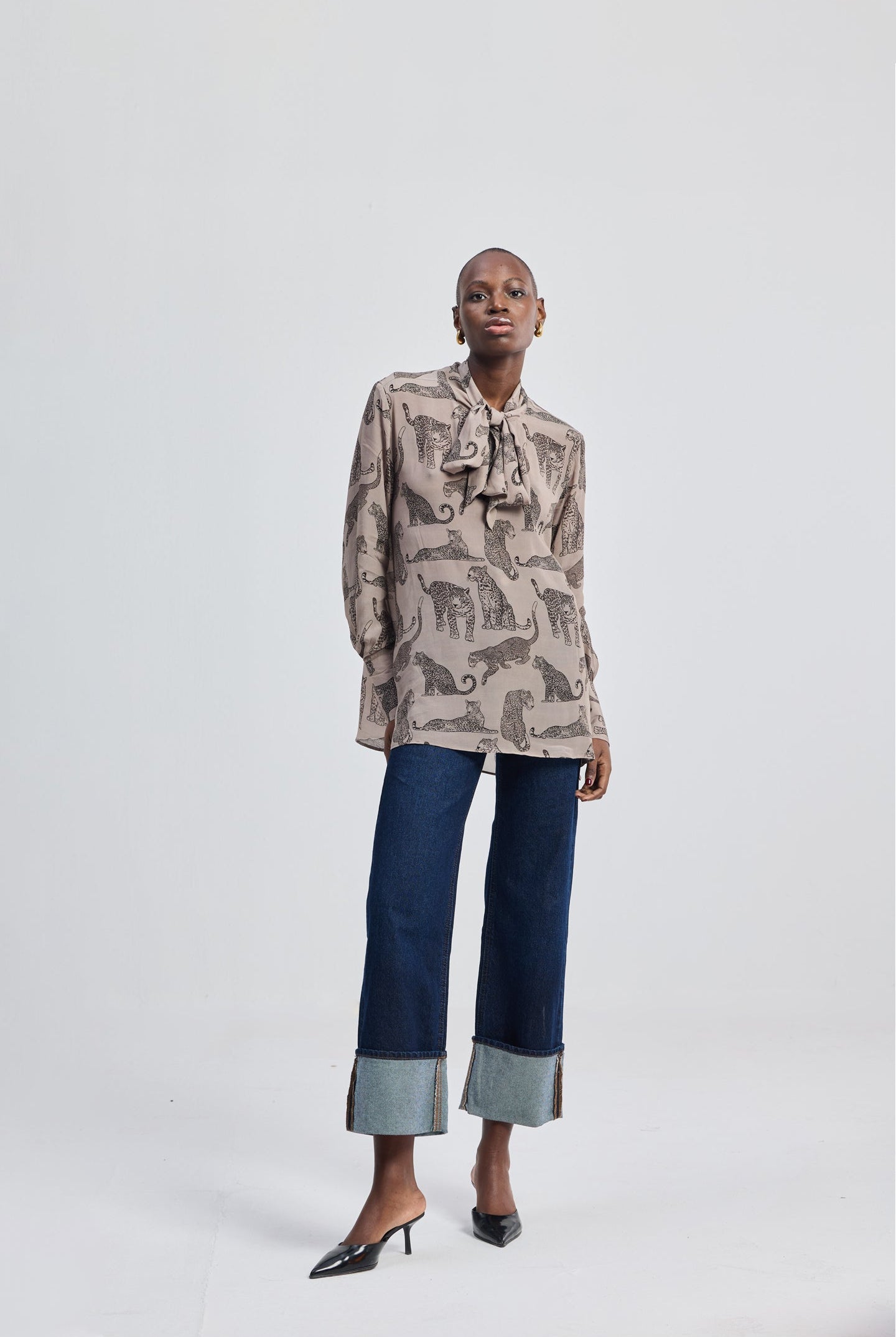 Relaxed-Fit Top with Front-tie in Animal Print by reistor, featuring a soft neutral-toned animal print design worn by a model in a minimalist studio setting.