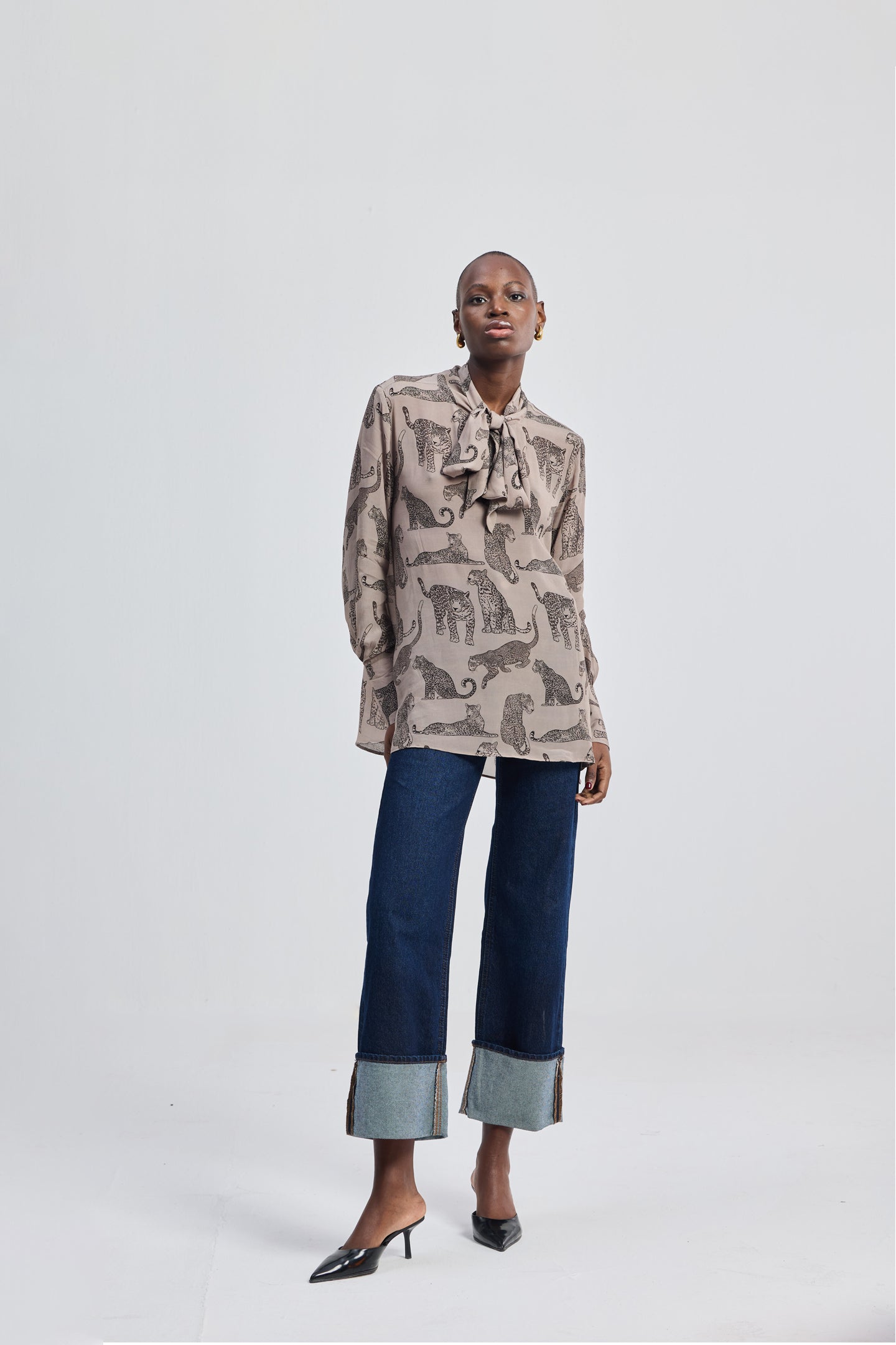 Relaxed-Fit Top with Front-tie in Animal Print by reistor, featuring a soft neutral-toned animal print design worn by a model in a minimalist studio setting.