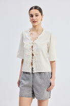 Relaxed Fit Top With Ruffles and Front-Ties in Cream Longshot