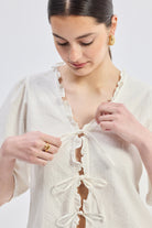 Relaxed Fit Top With Ruffles and Front-Ties in Cream Closeup