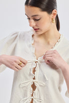 Relaxed Fit Top With Ruffles and Front-Ties in Cream Closeup