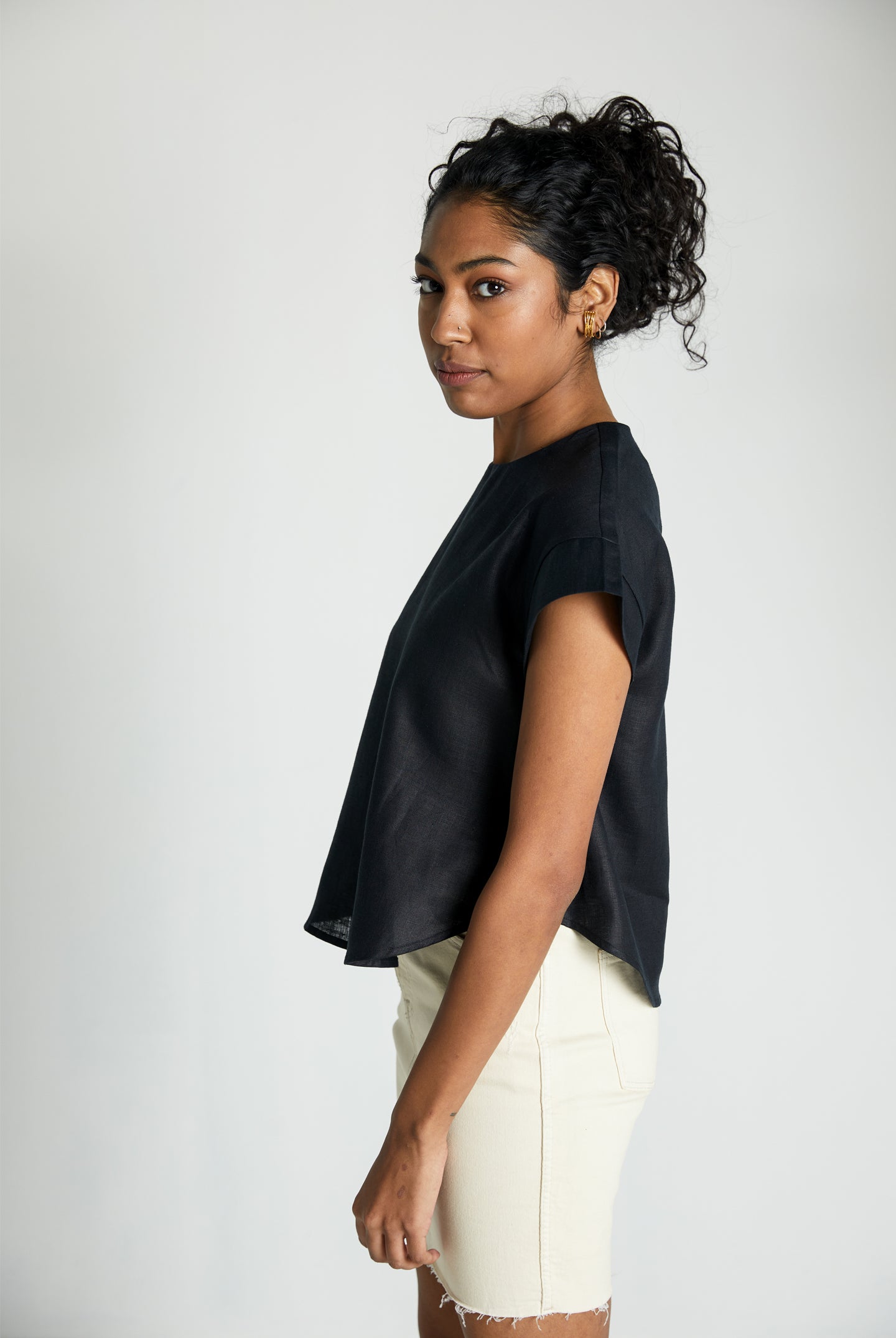Reistor Sandcastle Saturdays Top in Black, sustainable women's cap sleeve top with a relaxed silhouette, breathable fabric, and minimalist everyday style.