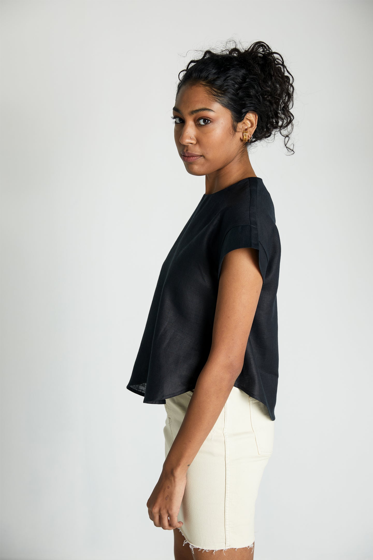 Reistor Sandcastle Saturdays Top in Black, sustainable women's cap sleeve top with a relaxed silhouette, breathable fabric, and minimalist everyday style.