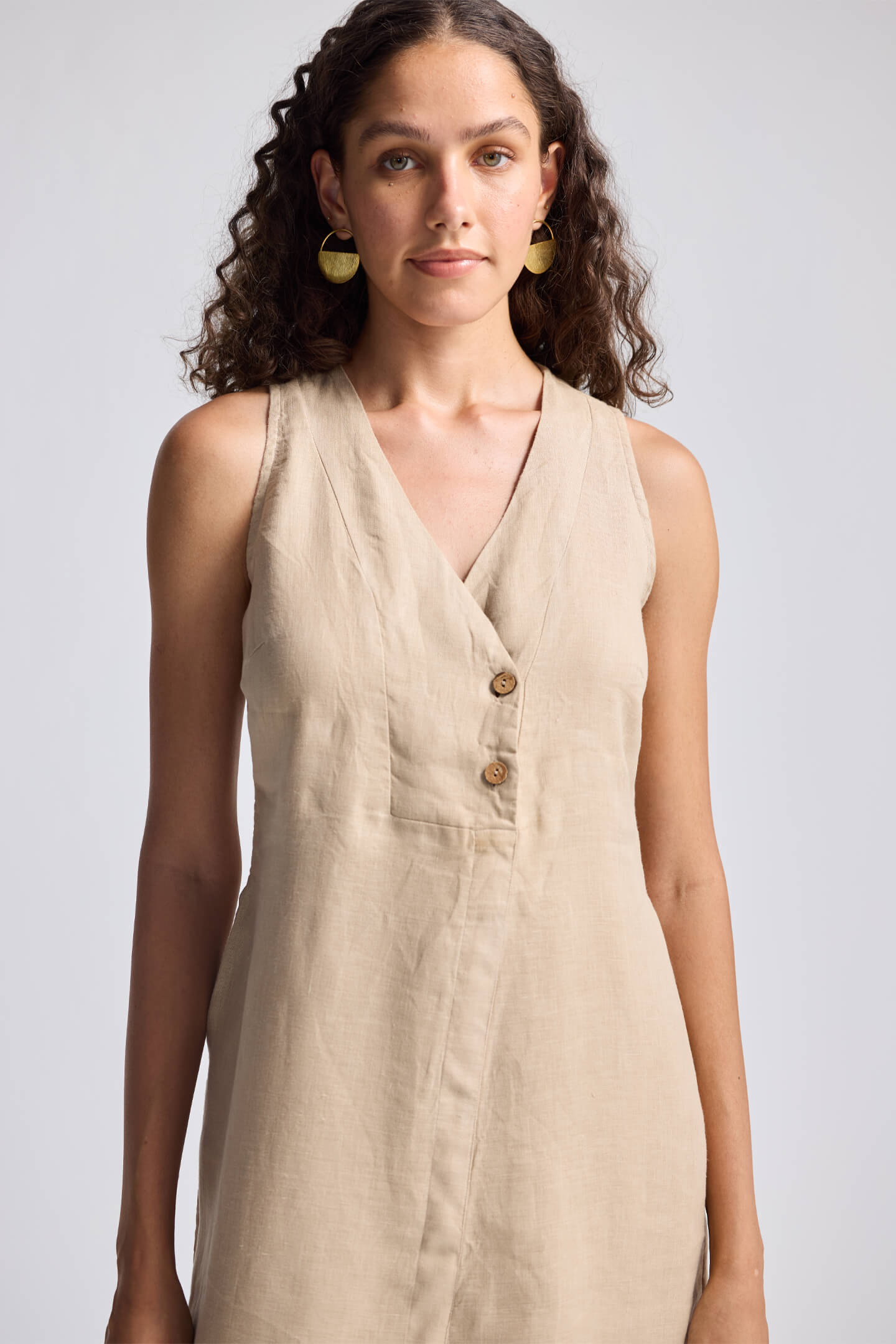 Straight Dress with Front Slit in Neutral Beige Hemp by Reistor, close-up view highlighting the sleeveless V-neck design, button-front detail, and soft breathable hemp fabric for women