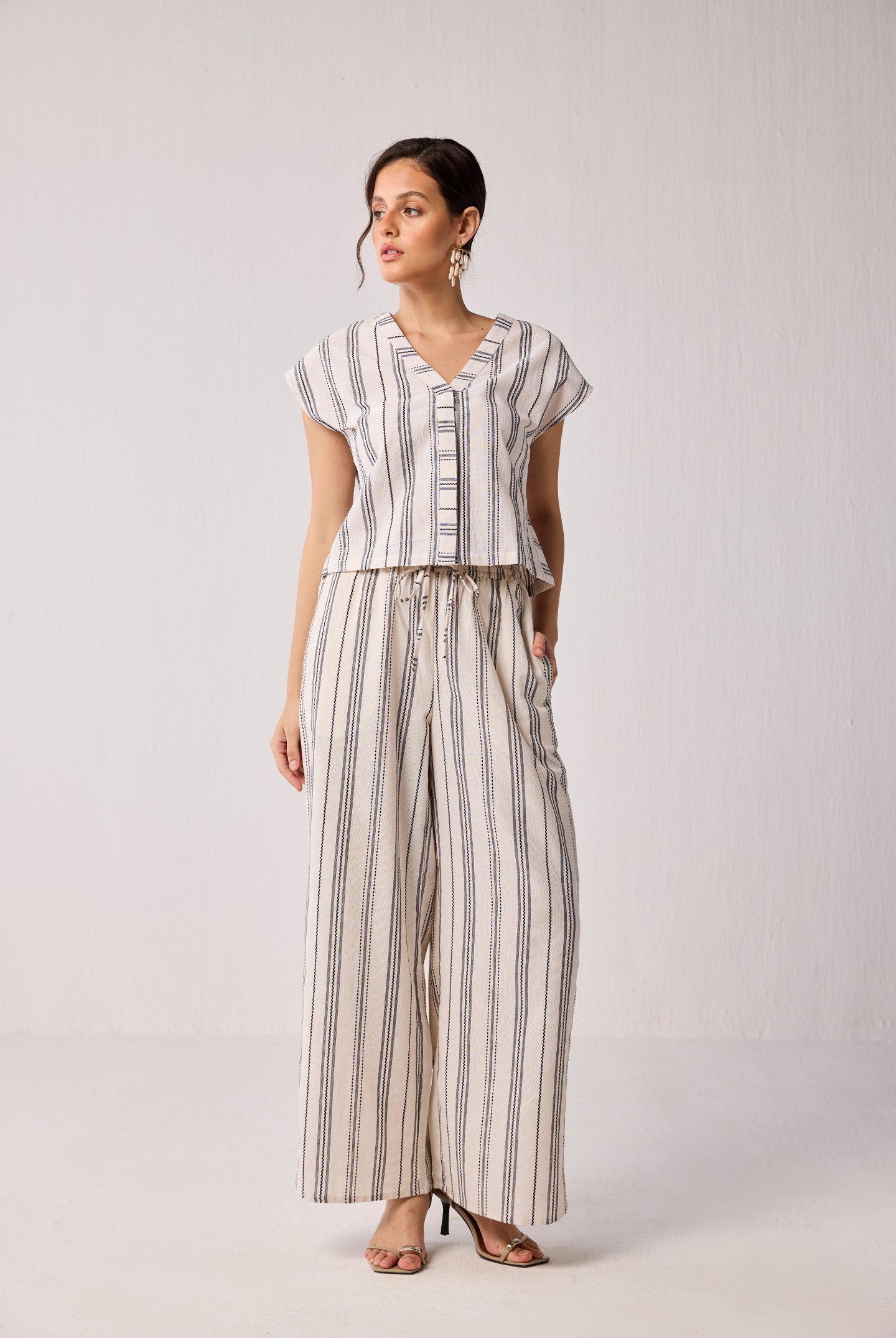 Front view of Striped Matching Set with Wide-Leg Pants and V-neck Top for women, featuring a relaxed-fit co-ord with vertical stripes and a flattering V-neck.