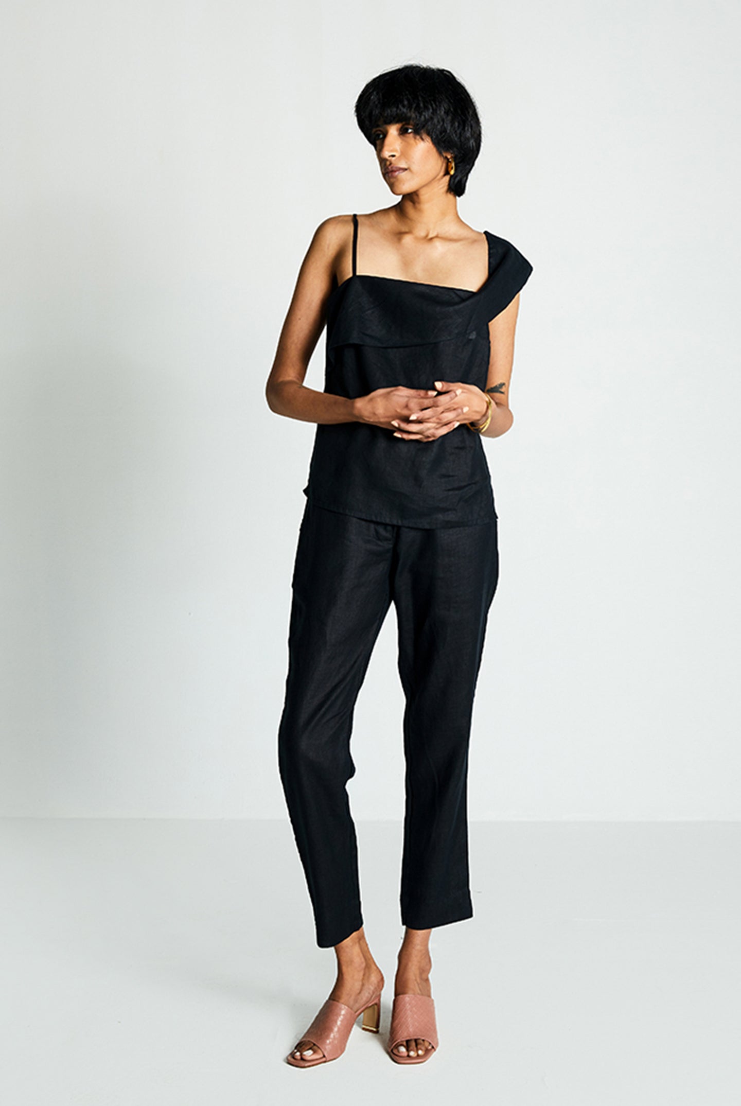 Reistor The Wandering Wave Top in Black, sustainable women's asymmetrical top with breathable fabric, relaxed fit, and minimalist everyday fashion.