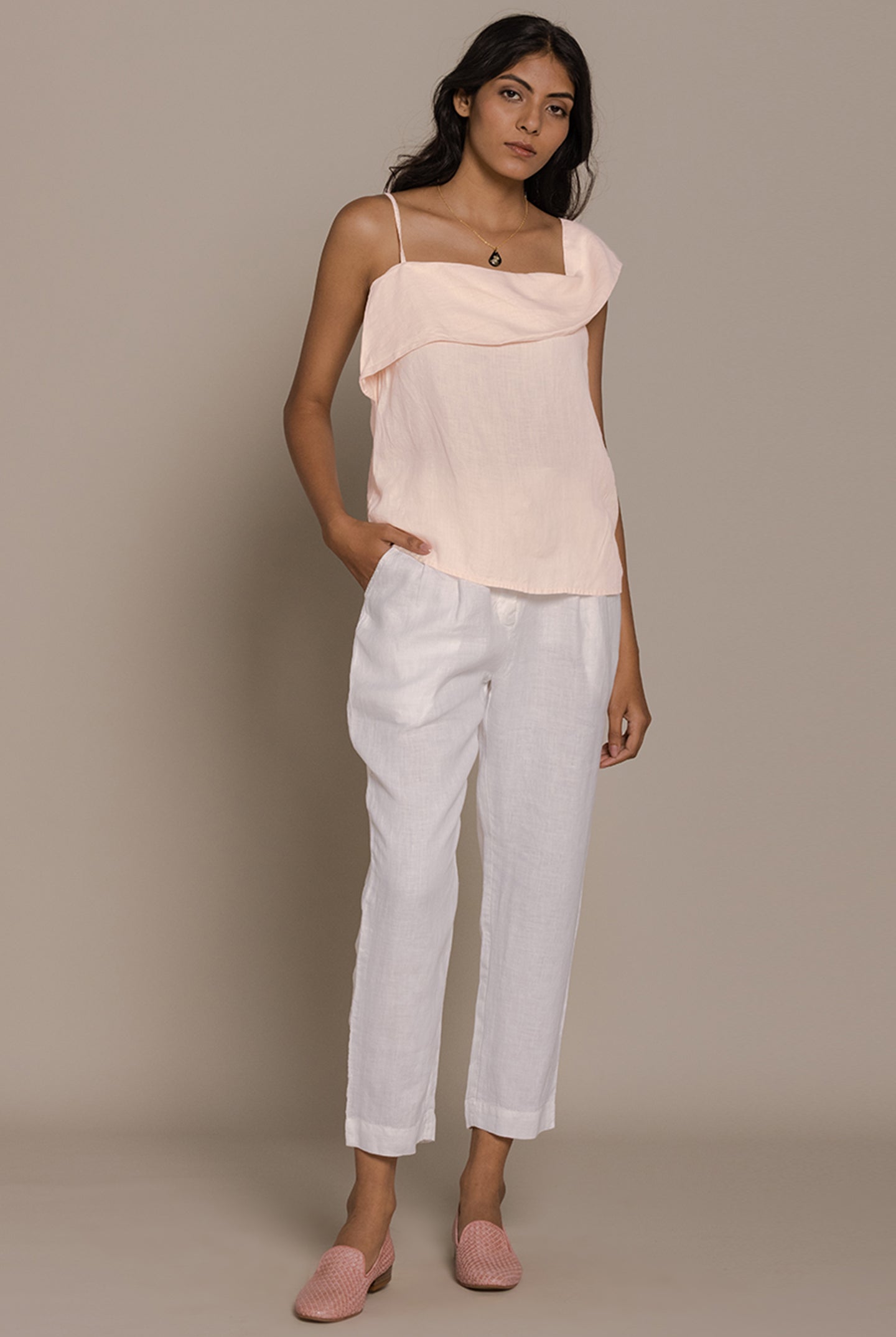 Reistor The Wandering Wave Top in Ice Pink pairs a fluid asymmetric drape with effortless everyday style.