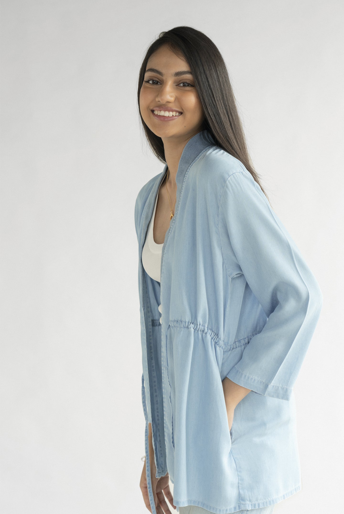 Side view of the Reistor Travel Light Denim Jacket in Ocean Blue, featuring lightweight denim, an open-front design and a relaxed silhouette for everyday wear.
