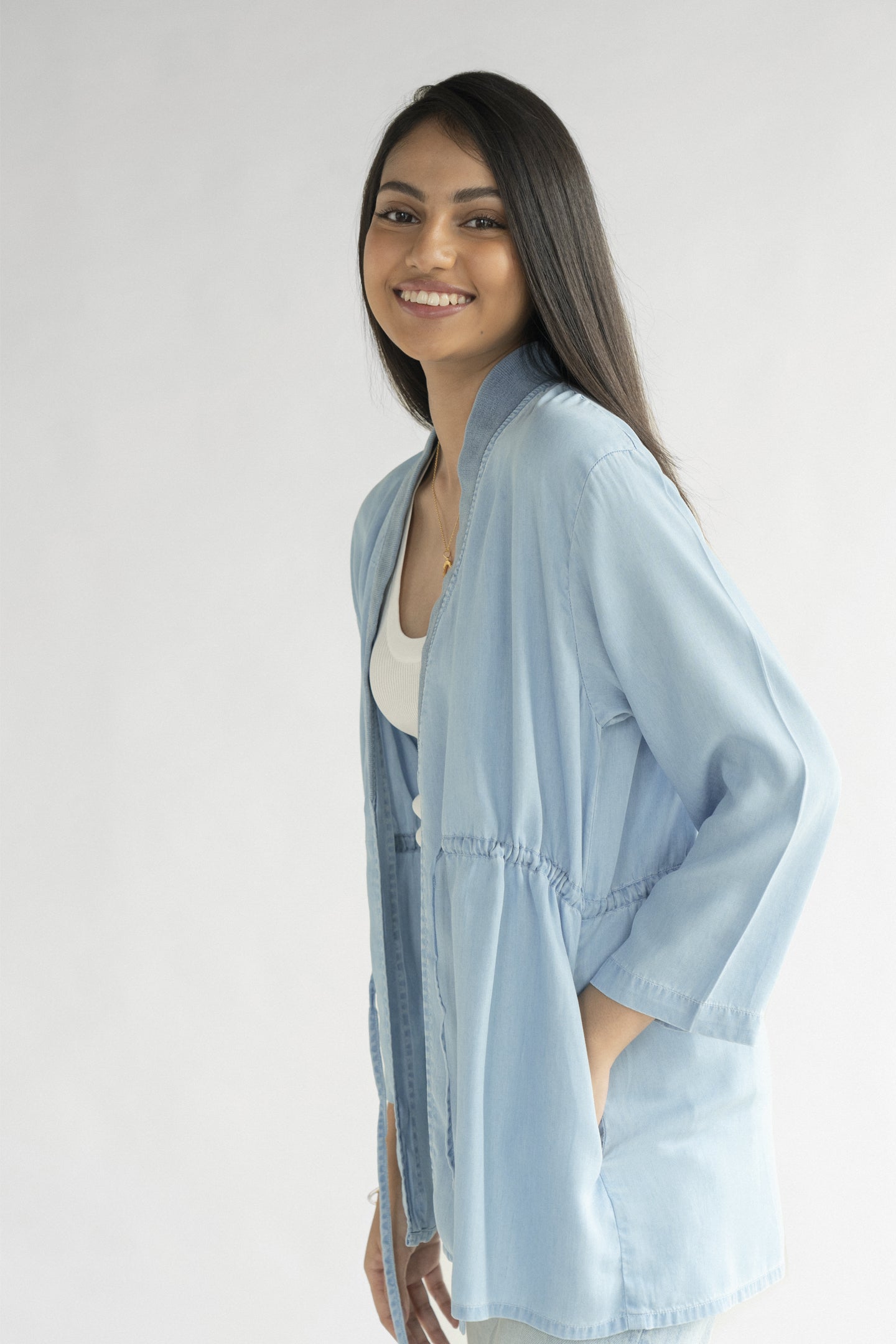 Side view of the Reistor Travel Light Denim Jacket in Ocean Blue, featuring lightweight denim, an open-front design and a relaxed silhouette for everyday wear.