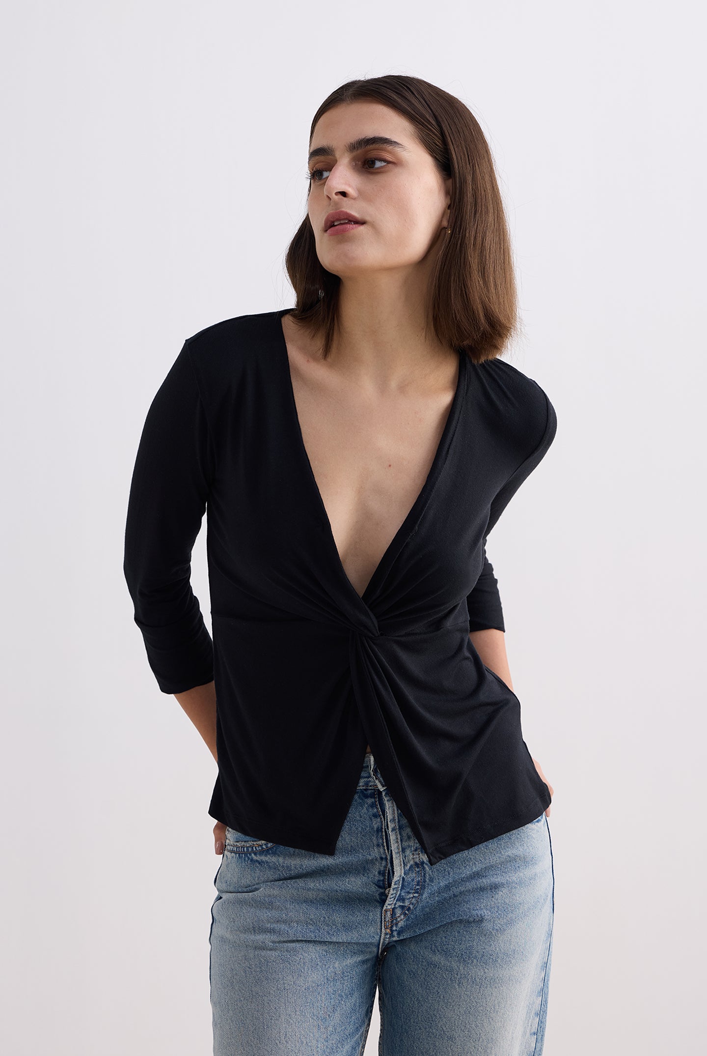 Twist Front Knit Shirt in Black Longshot