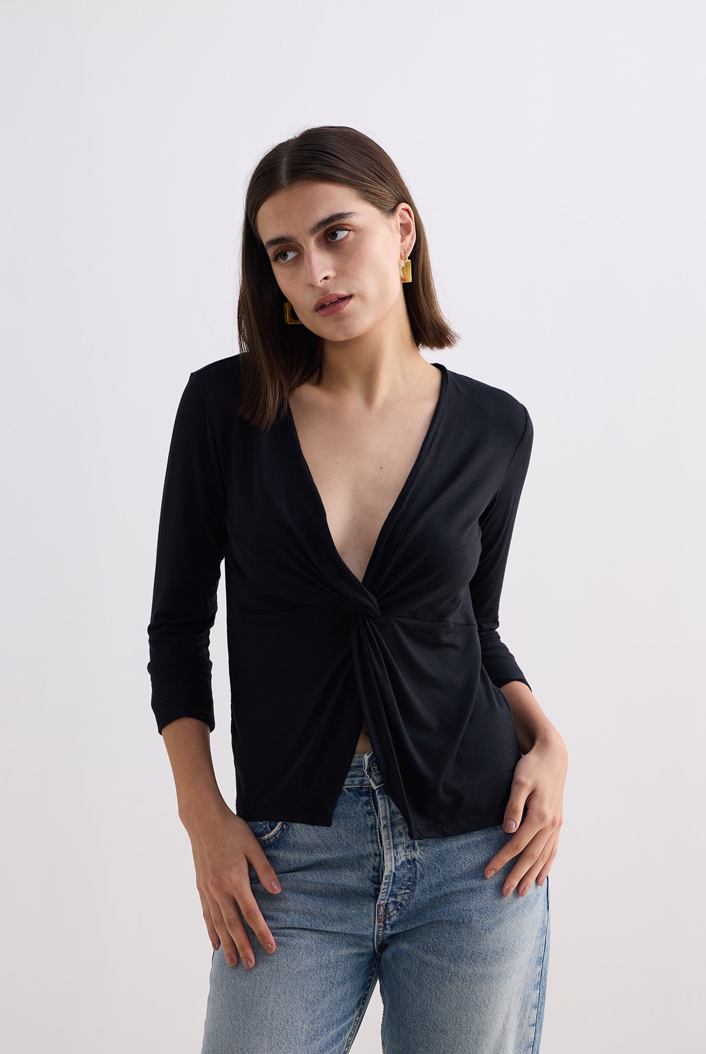 Twist Front Knit Shirt in Black Longshot