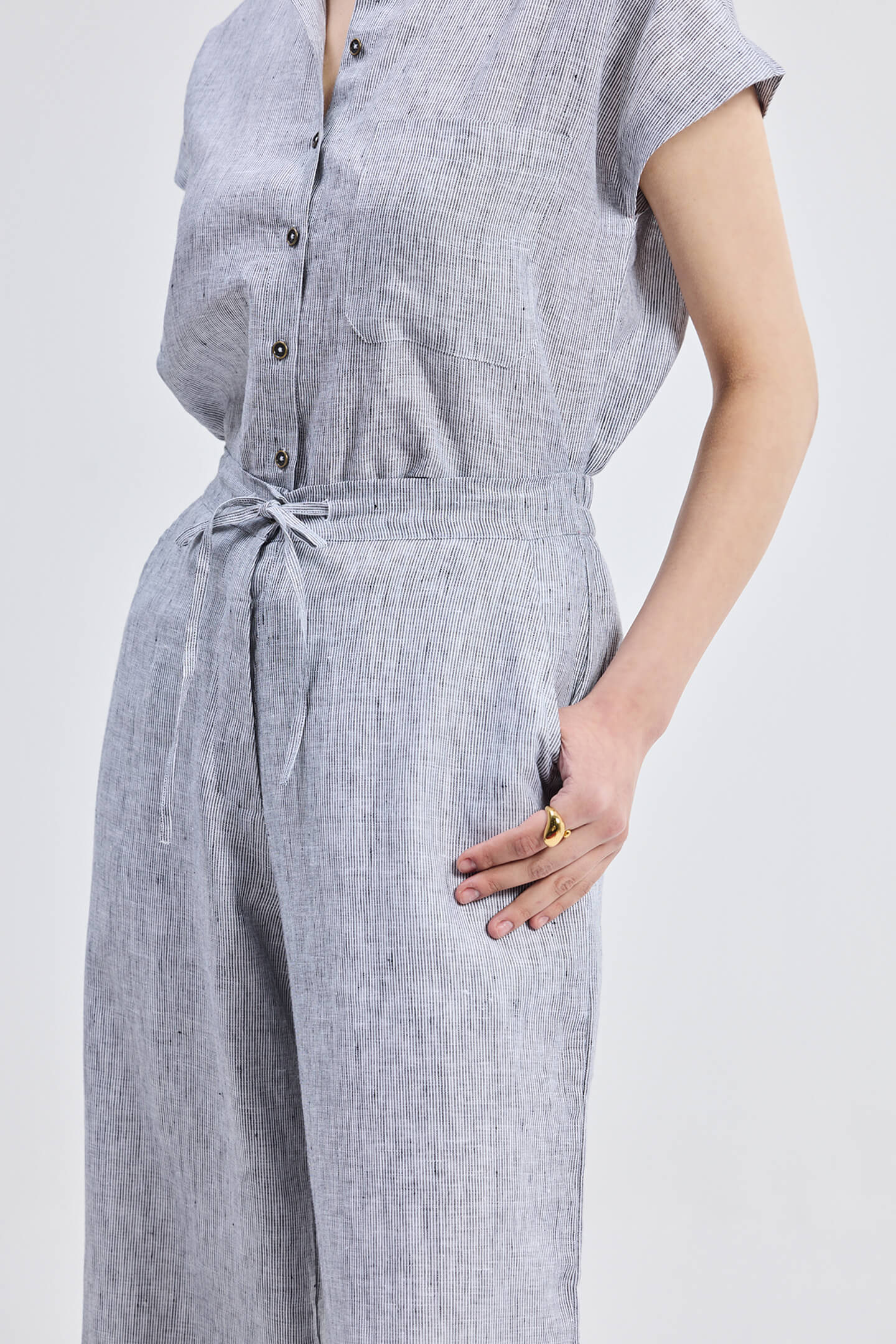 Sustainable Wide Leg Linen Pants in a grey striped pattern by Reistor, featuring a drawstring waist.