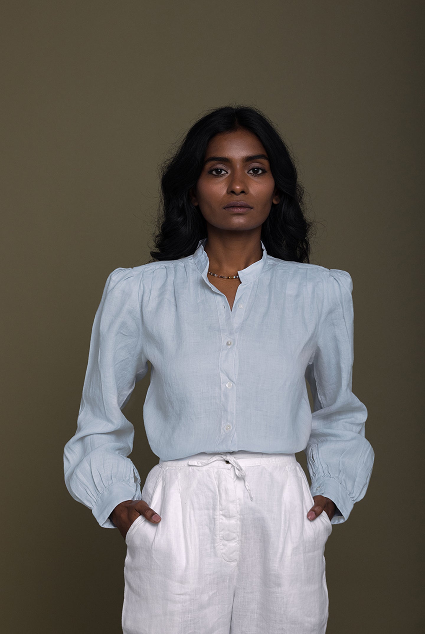 Classic front view of the Reistor Wild River Shirt in Blue, crafted from soft sustainable fabric with elegant gathered sleeves and a relaxed modern silhouette.