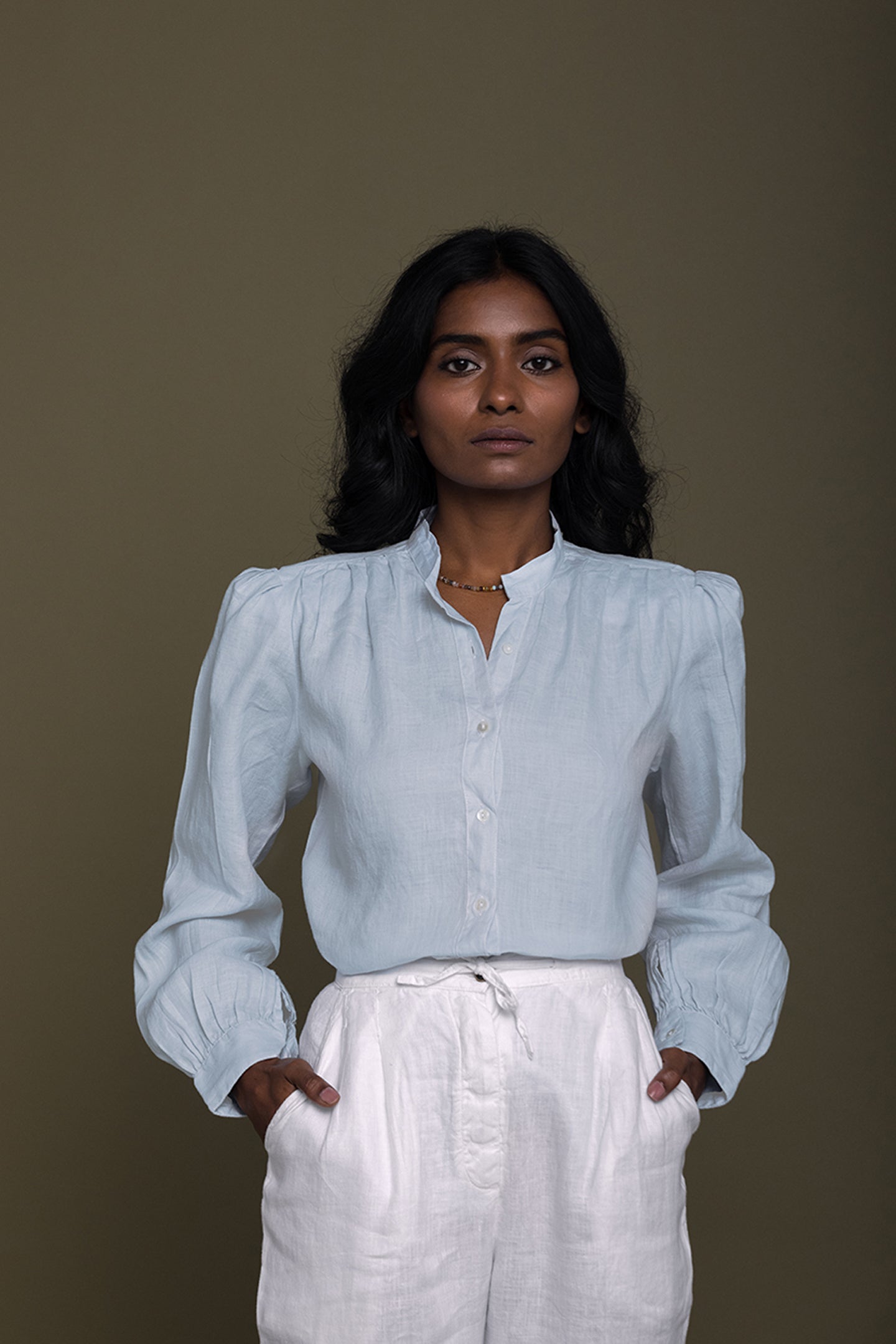 Classic front view of the Reistor Wild River Shirt in Blue, crafted from soft sustainable fabric with elegant gathered sleeves and a relaxed modern silhouette.
