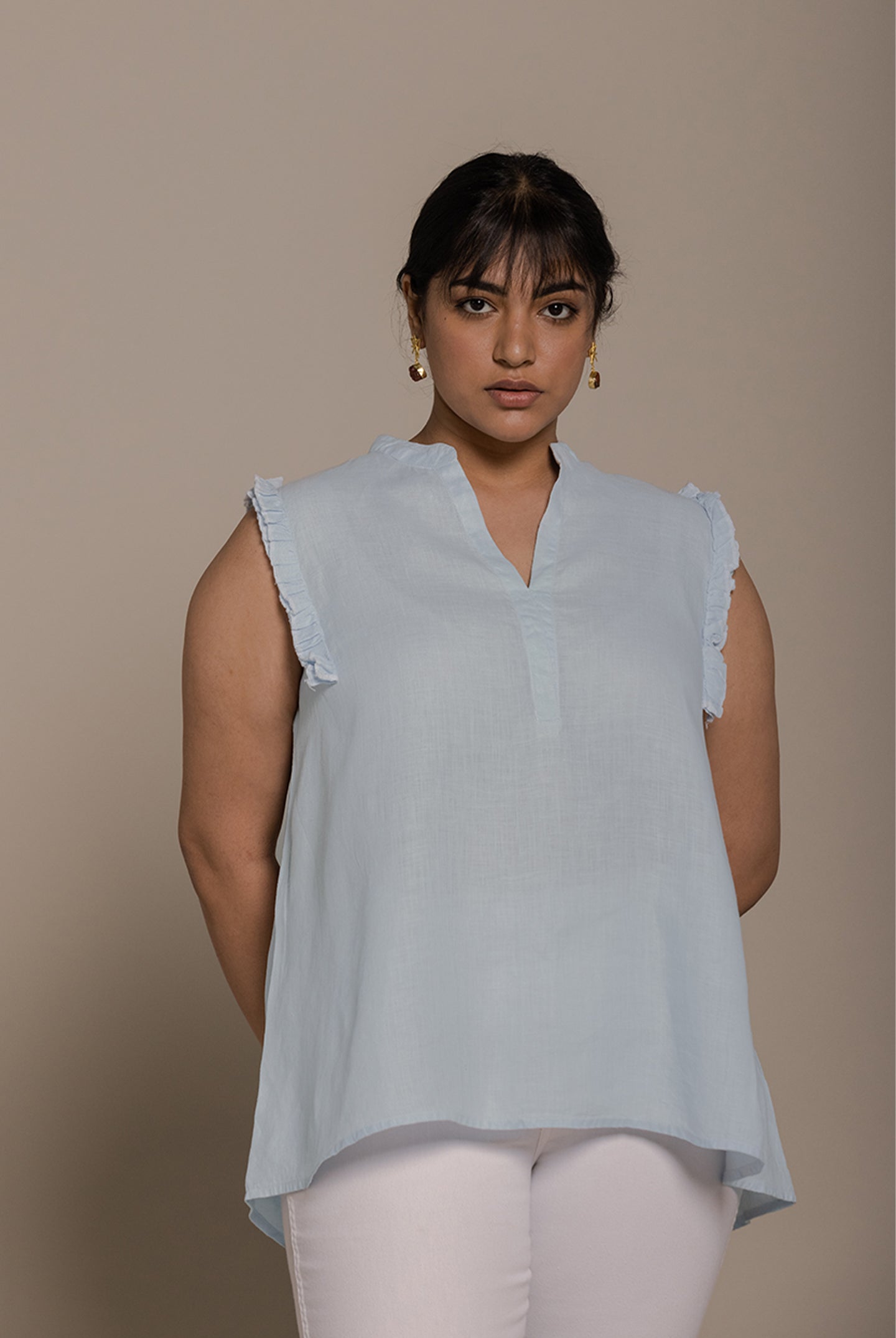Reistor Wind in my Hair Shirt in Blue with soft ruffle sleeves, breezy sustainable fabric and a relaxed fit for women