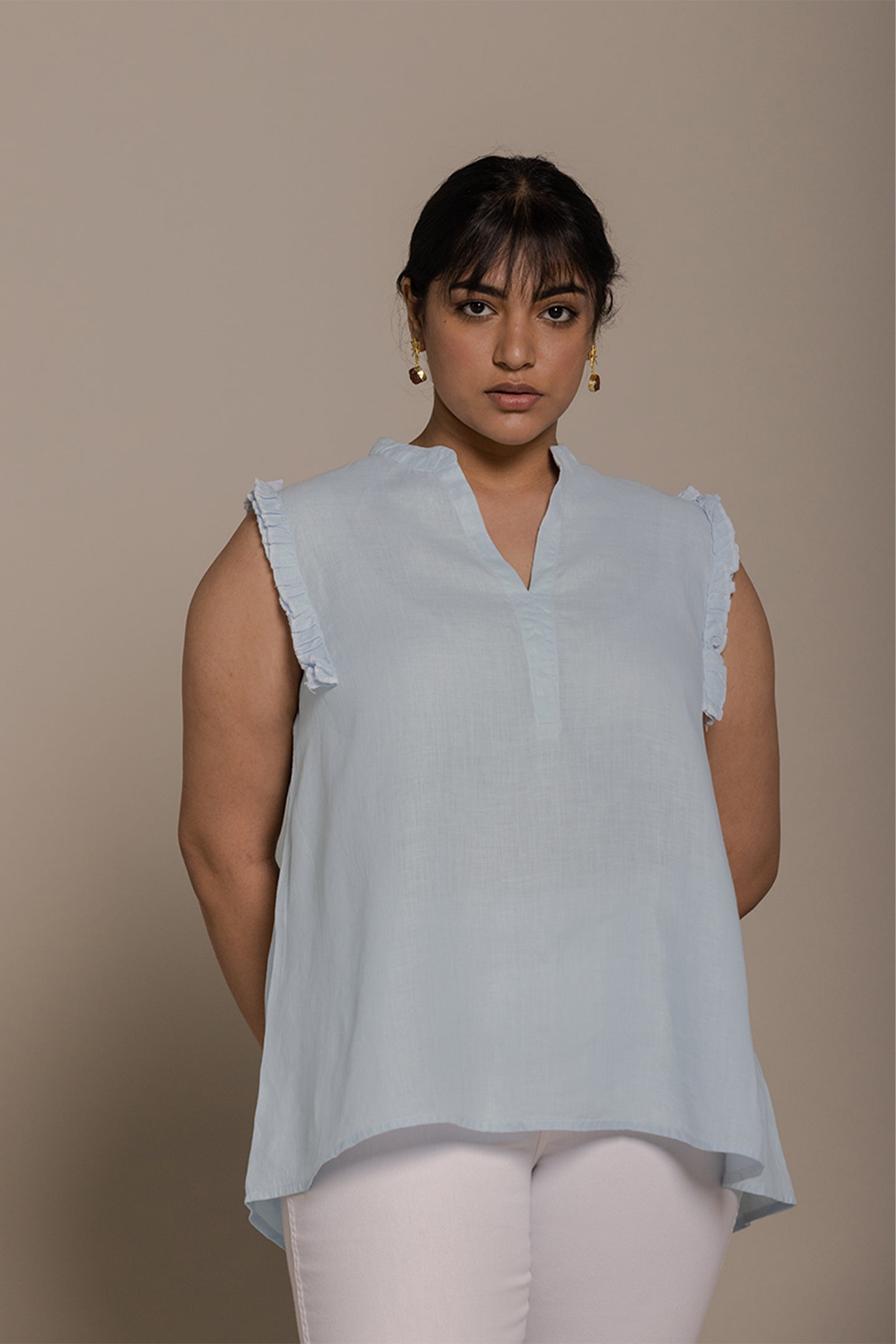 Reistor Wind in my Hair Shirt in Blue with soft ruffle sleeves, breezy sustainable fabric and a relaxed fit for women