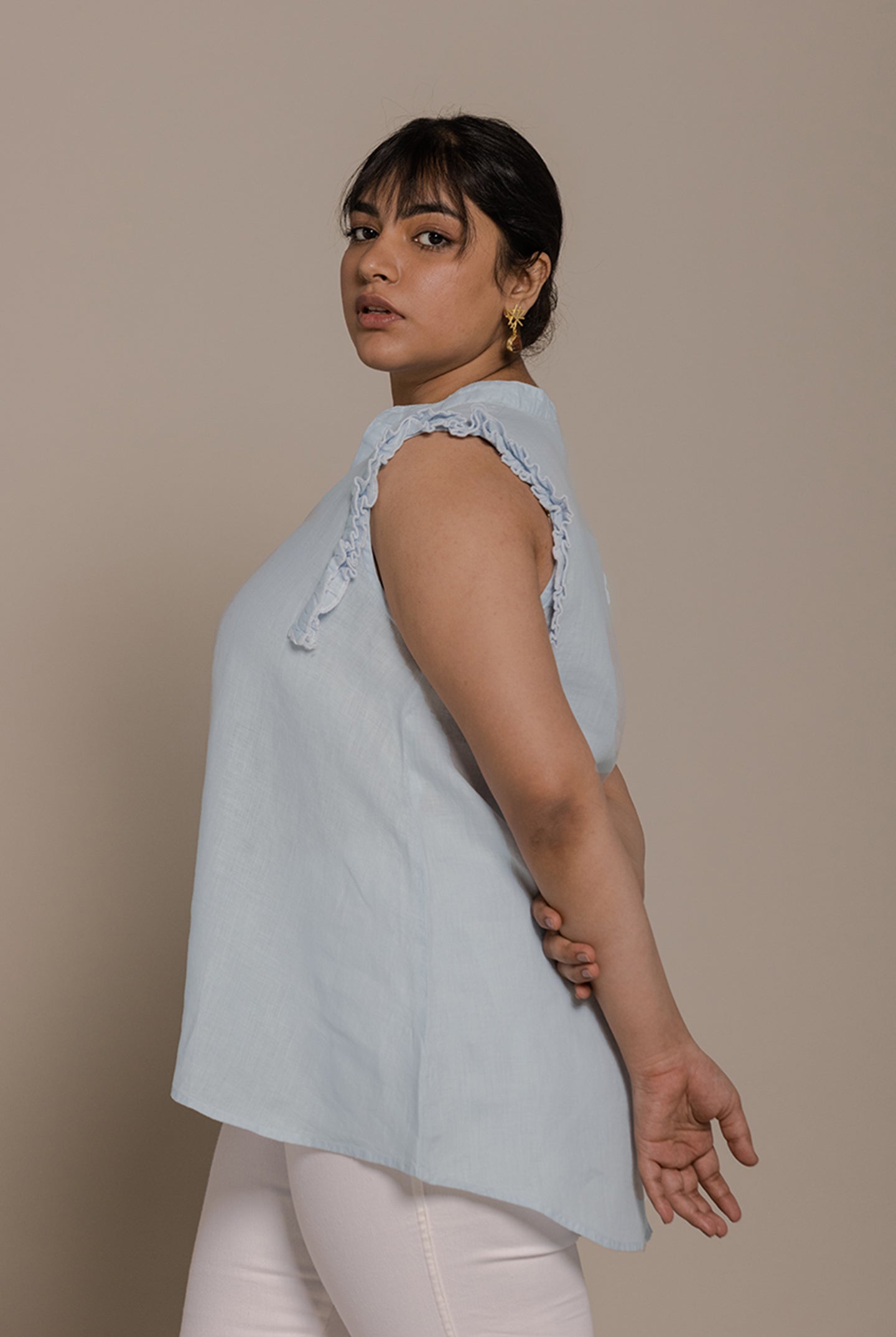Reistor Wind in my Hair Shirt in Blue with soft ruffle sleeves, an airy relaxed fit and breathable sustainable fabric for women