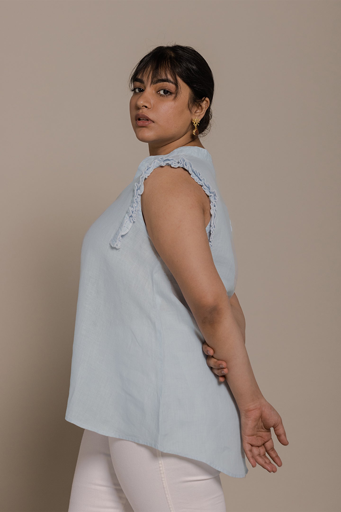 Reistor Wind in my Hair Shirt in Blue with soft ruffle sleeves, an airy relaxed fit and breathable sustainable fabric for women