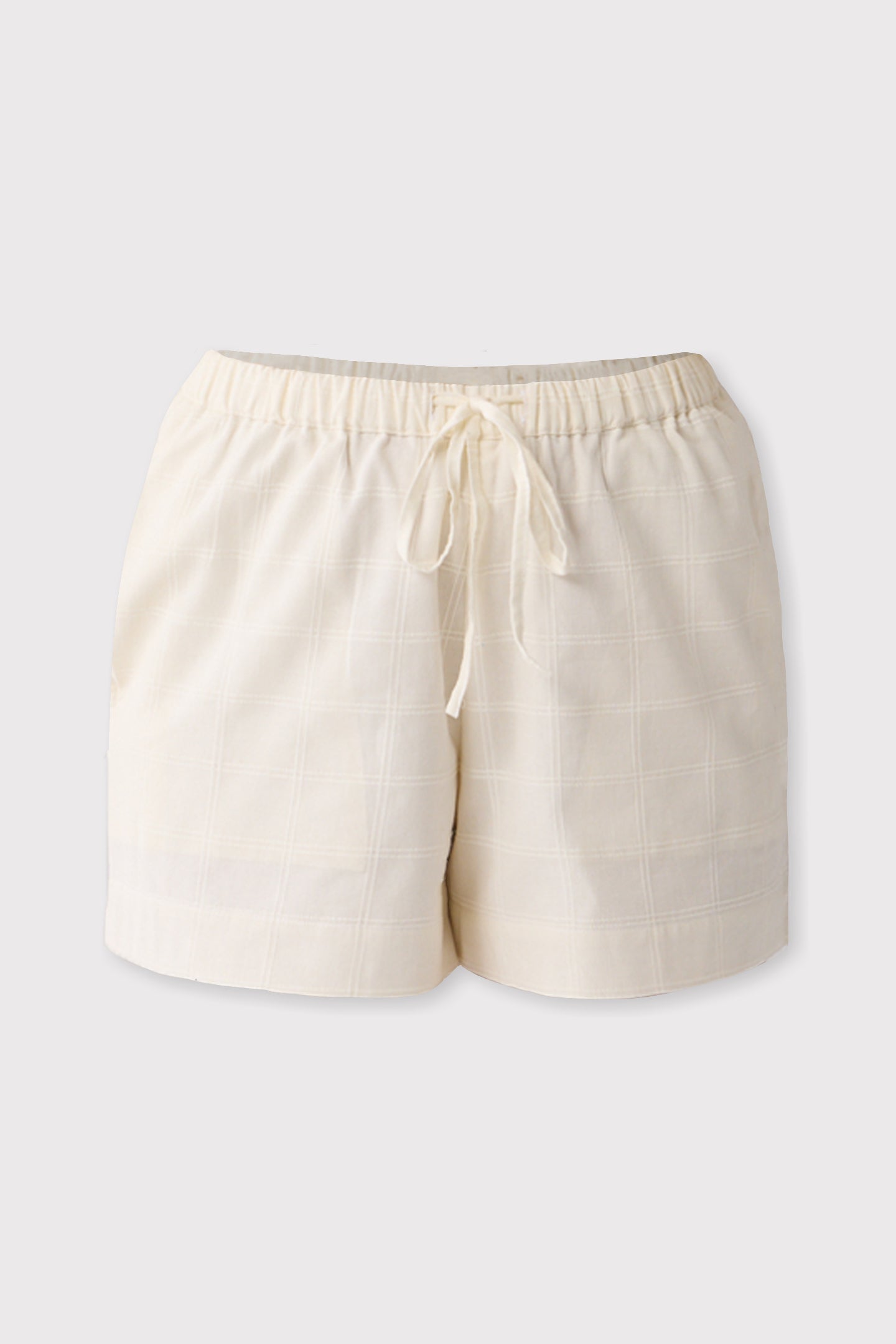 Off-white shorts with a drawstring on a light gray background