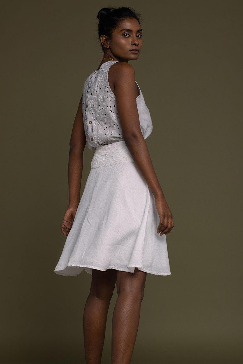 white straight comfort-fit skirt with an embroidered belt to accentuate the waistline.