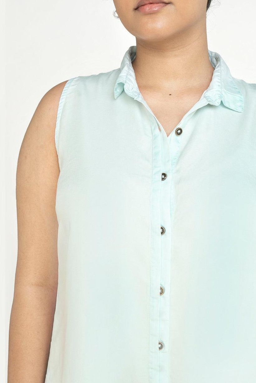 Close-up of Reistor Dreaming of Blue Skies Dress featuring a sleeveless collared neckline, button-front design, and soft sustainable fabric for everyday comfort.
