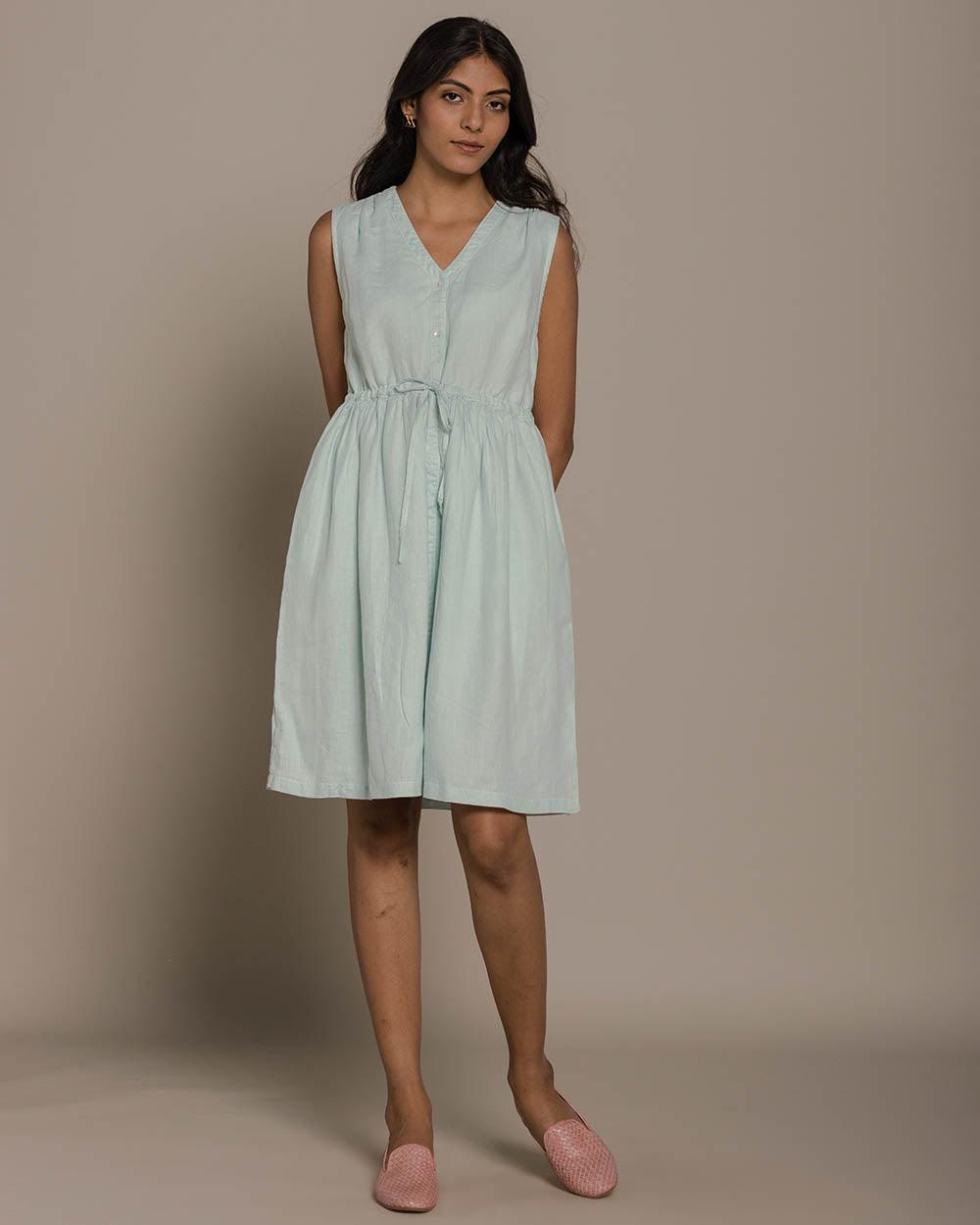 mint buttoned down sleeveless dress with a drawstring at the waist to give it more definition