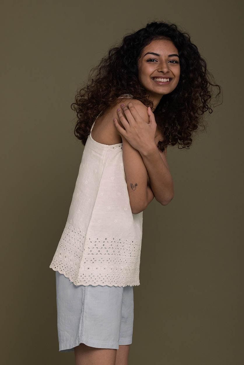 off white T back top with a v neck and embroidered details front and behind