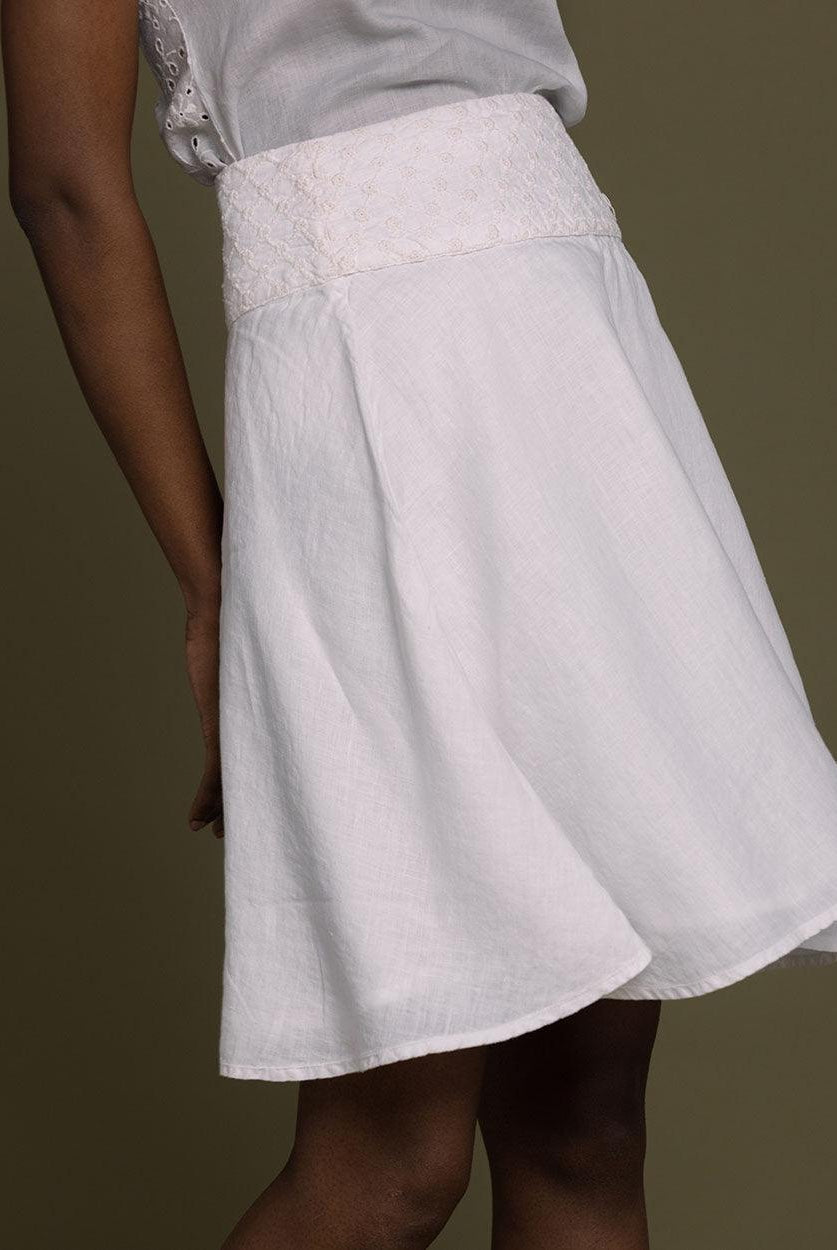 white straight comfort-fit skirt with an embroidered belt to accentuate the waistline.