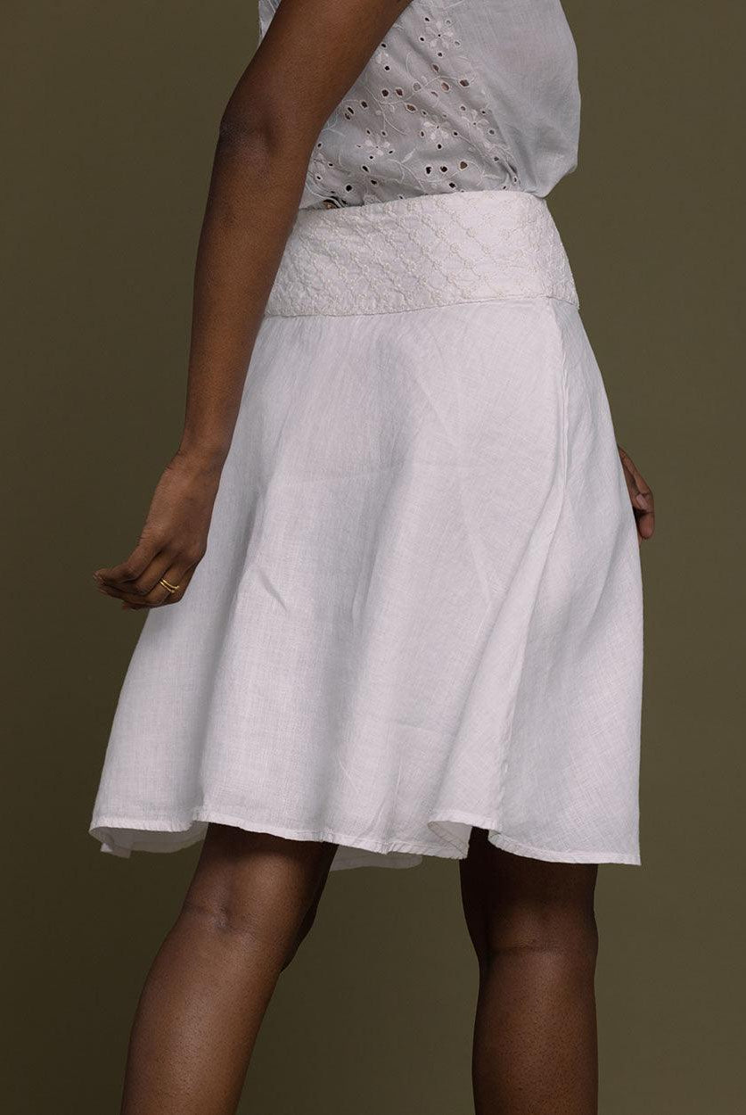 white straight comfort-fit skirt with an embroidered belt to accentuate the waistline.
