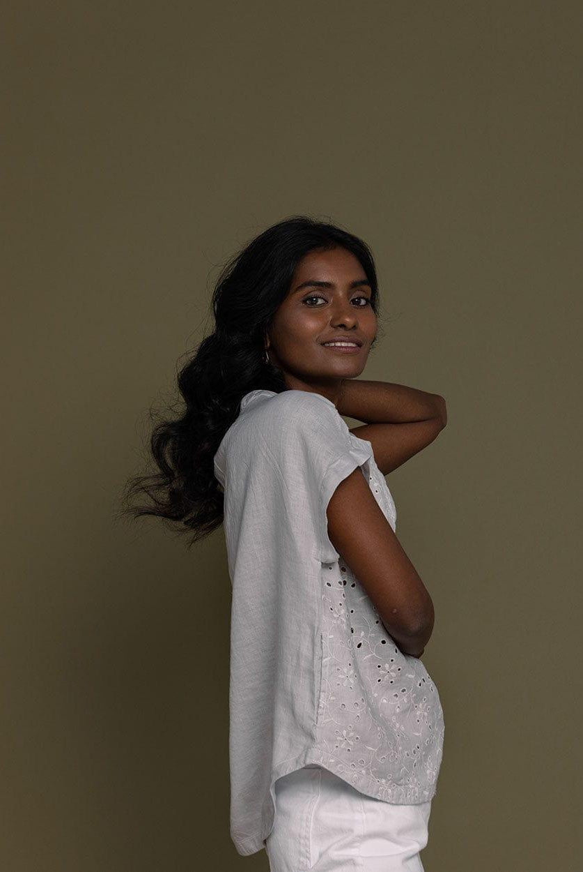 cloud grey embroidered top with side pockets.