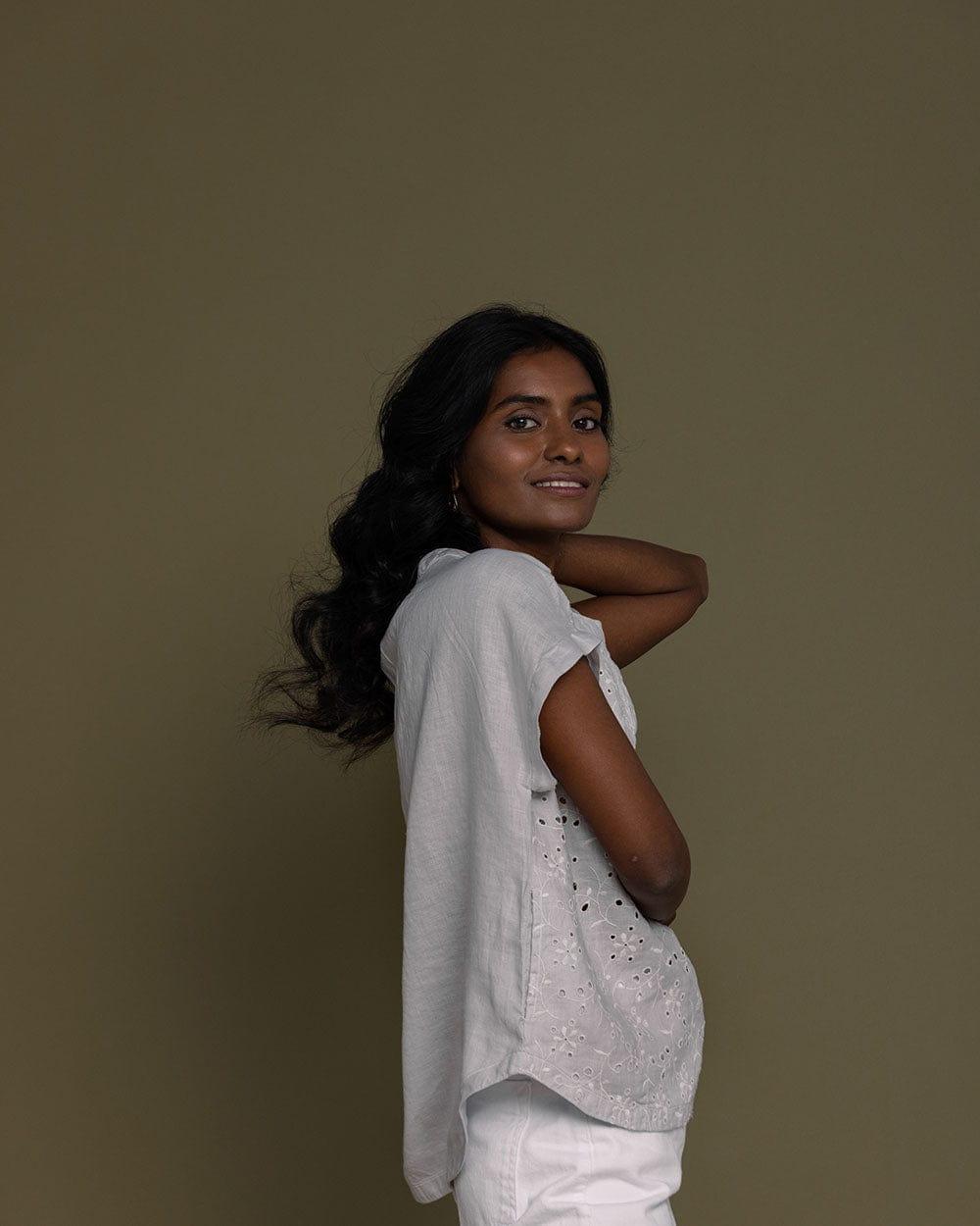 cloud grey embroidered top with side pockets.