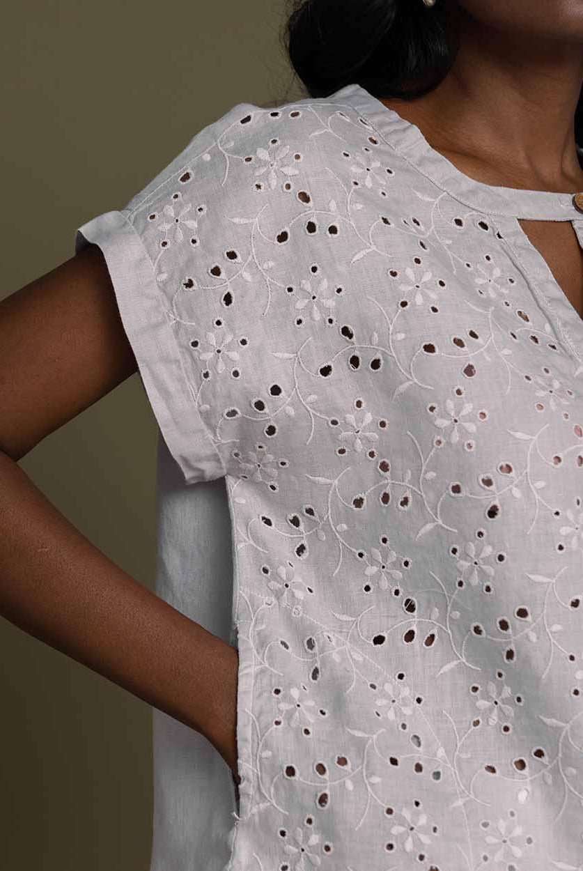 cloud greyembroidered top with side pockets.