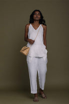 Comfortable white pants, with pockets and a drawstring at the waist.